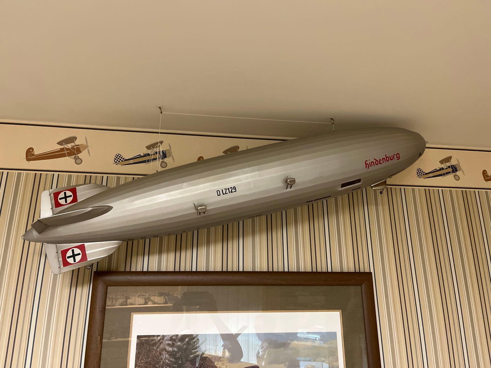 Hindenburg LZ 129 Display Model Airship: 64 inches long. This is a large-scale static display model representing the LZ 129 Hindenburg airship. The model is constructed from a lightweight composite material with a metallic silver-toned finis