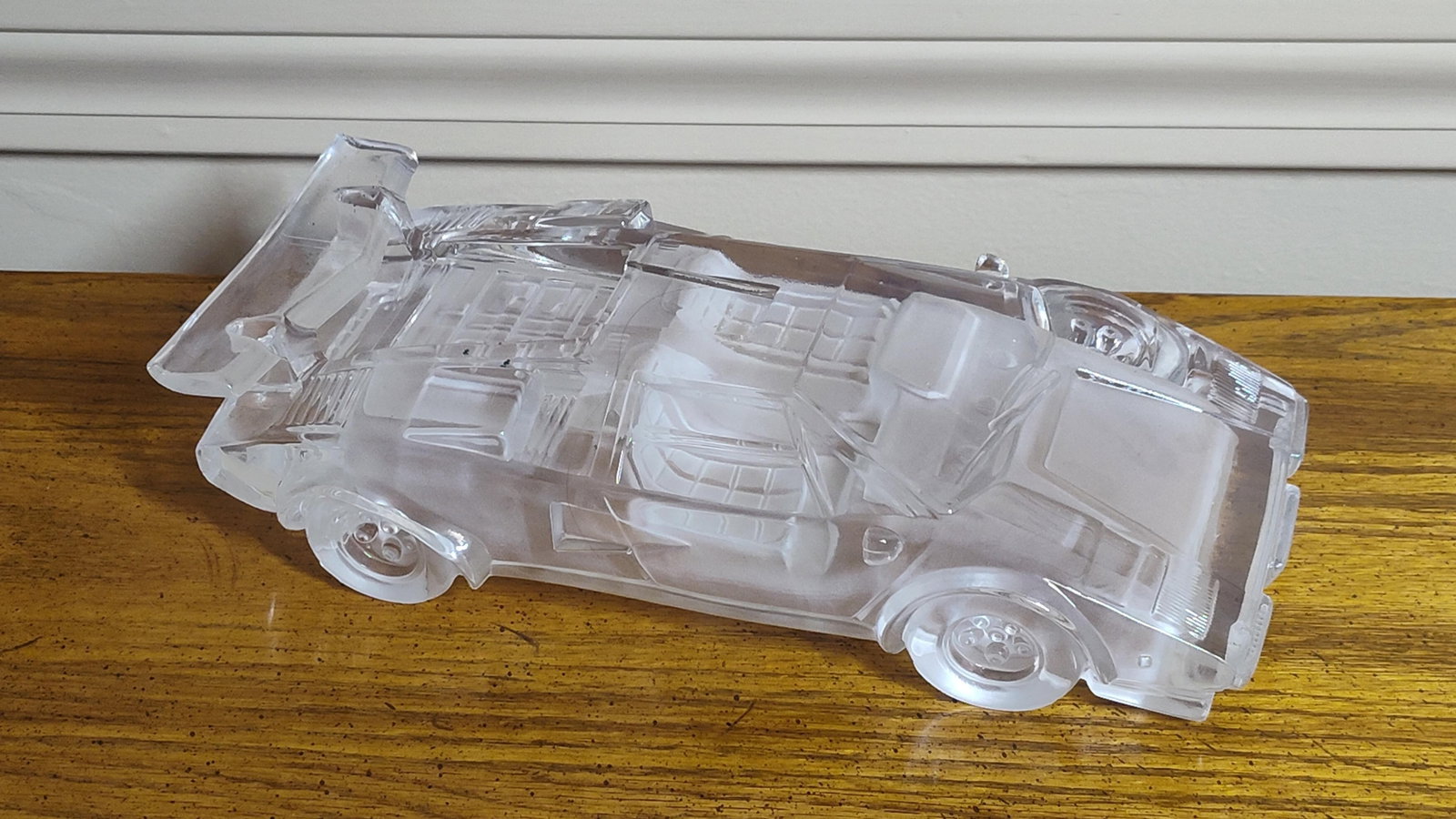 Hofbauer Crystal Lamborghini Countach Model: This molded glass model of a Lamborghini Countach is attributed to the German manufacturer Hofbauer and likely dates to the 1980s. The piece depicts the iconic sports car, specifically resembling the