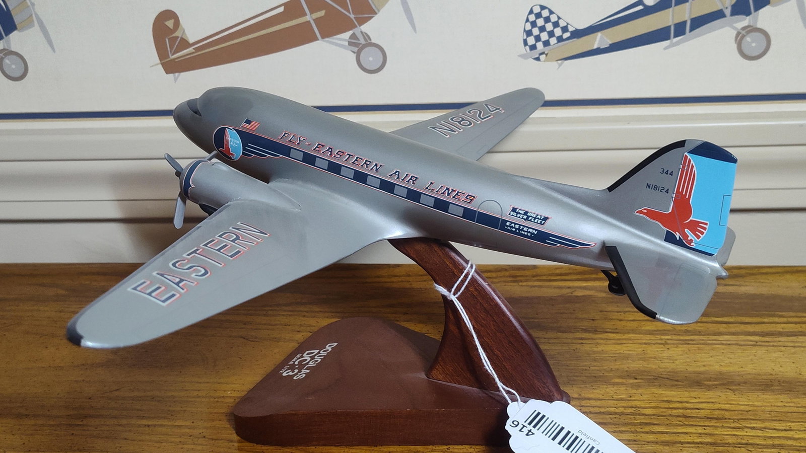 Douglas DC-3 Eastern Air Lines 1/72 Desktop Model: This 1/72 scale desktop display model of a Douglas DC-3 is finished in the historic Eastern Air Lines "The Great Silver Fleet" livery. Attributed to Scalecraft, the model is constructed from wood with