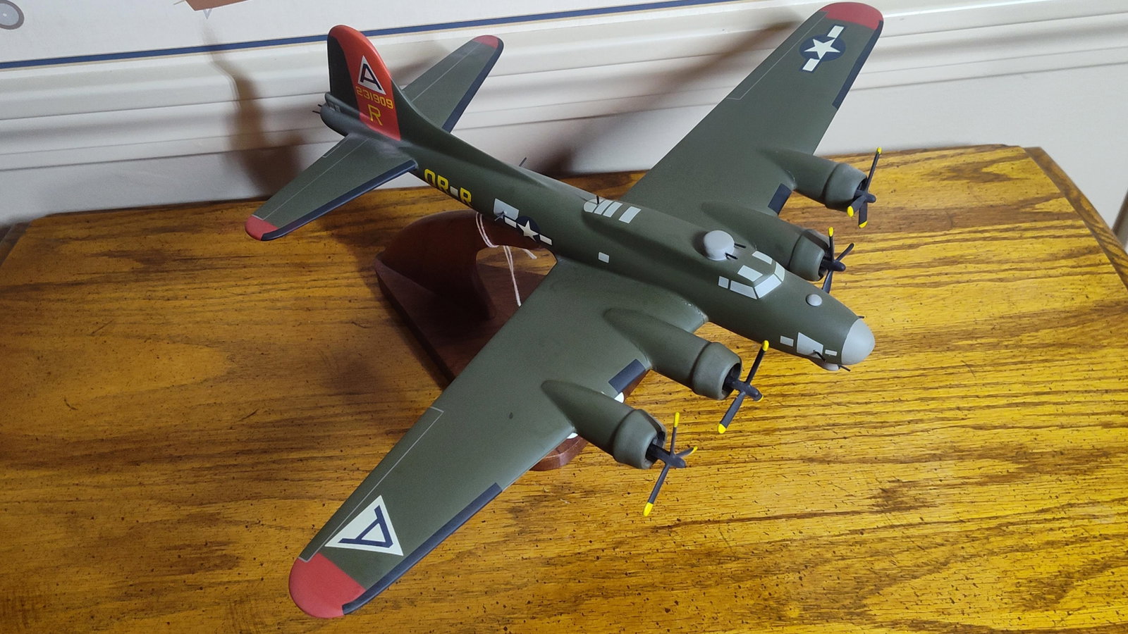 Boeing B-17G Flying Fortress Nine-O-Nine Model: This is a professional desktop display model of a Boeing B-17G Flying Fortress bomber. The static model is finished in a matte olive drab livery with a neutral gray underside and distinctive red