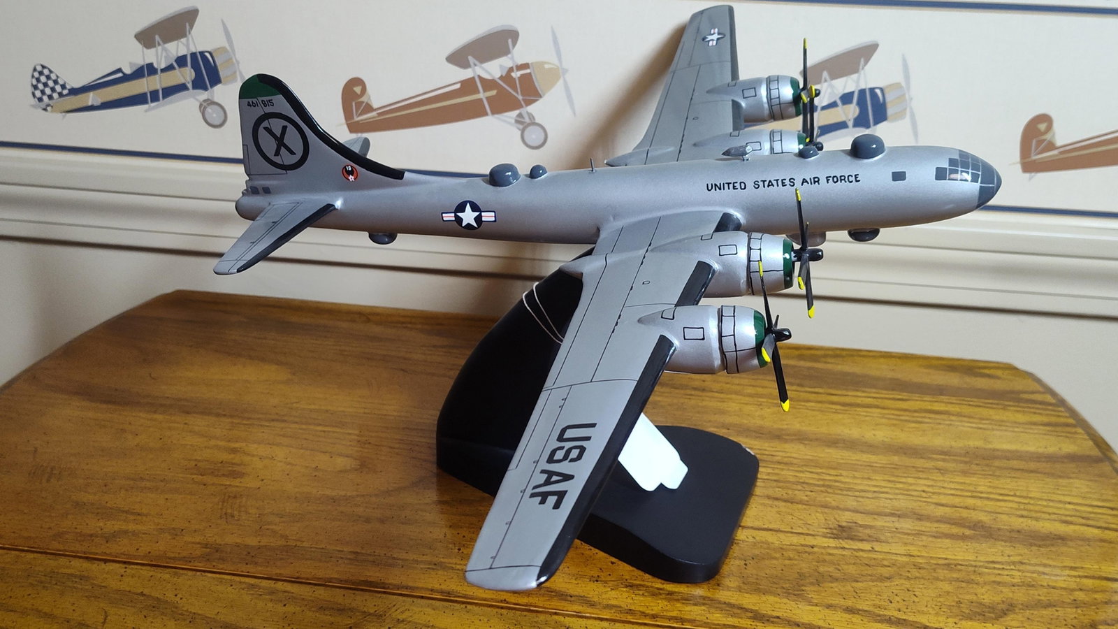 Boeing B-29 Superfortress Desktop Display Model: A professional desktop display model of a Boeing B-29 Superfortress four-engine heavy bomber. The model features a silver metallic finish with black-inked panel lines and is mounted on a curved black 
