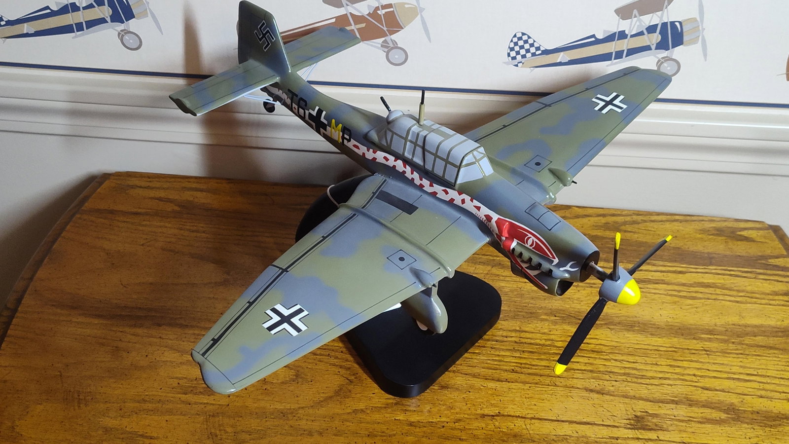 Junkers Ju 87 Stuka Desert Snake Livery Desk Model: Desk display model representing a Junkers Ju 87 Stuka dive bomber. The model is constructed from carved wood or heavy composite material and features a professional high-gloss hand-painted finish. It 