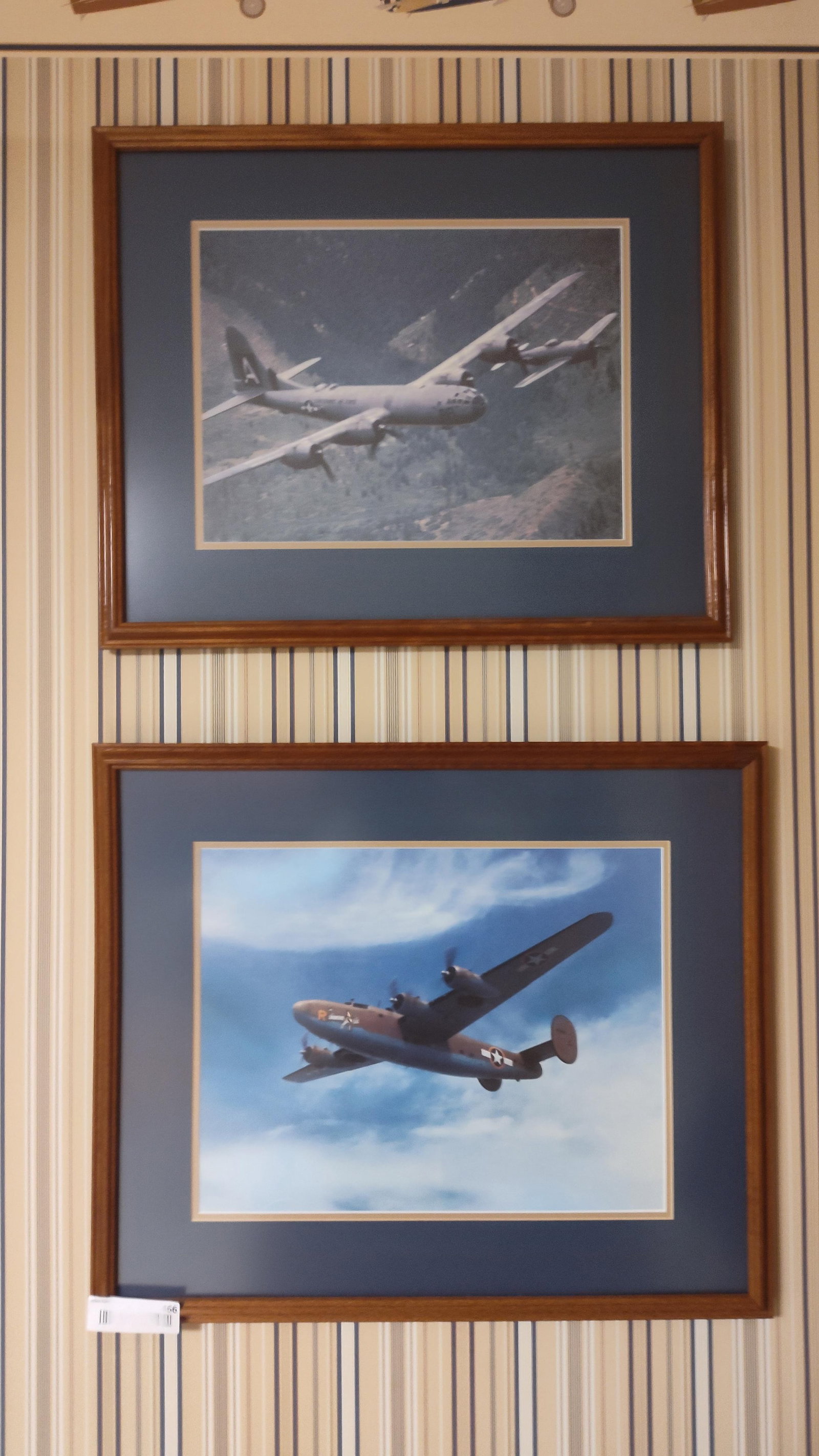 Pair Framed B-29 & B-24 Heavy Bomber Photo Prints: This lot features two framed color photographic prints depicting iconic World War II-era heavy bombers in flight. The upper print shows the Boeing B-29 Superfortress "FIFI" over a forested, mountainou