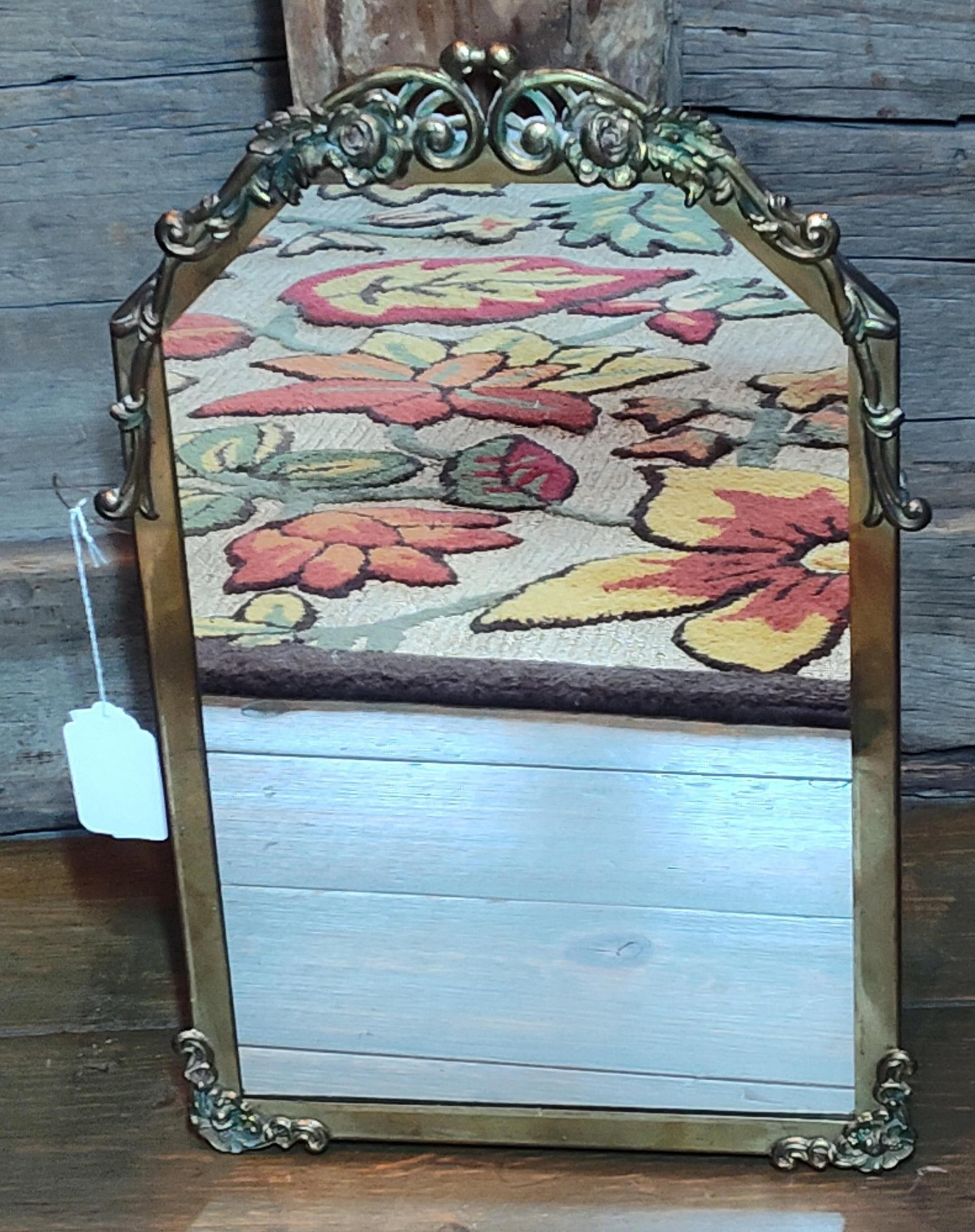 Vintage Rococo Style Arched Gilt Metal Mirror: A vintage mirror featuring an arched cast metal frame with a gold-toned finish. The frame is embellished with ornate Rococo-style decorative elements, including a crown with pierced scrolling foliate