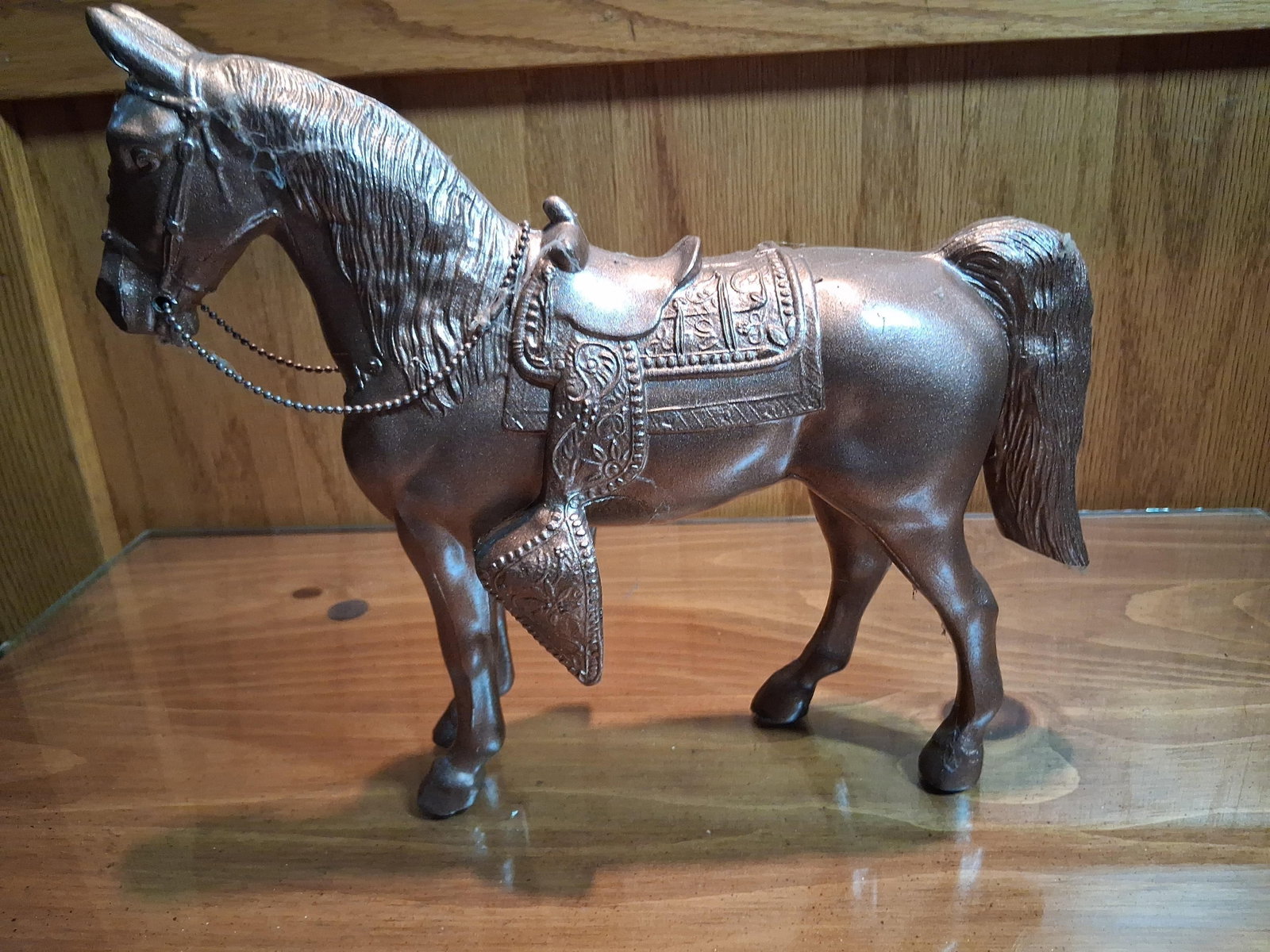 Mid-C. Copper Finish Metal Western Horse Figurine: This item is a mid-20th-century decorative figurine of a horse in Western parade gear. It is constructed from hollow-cast white metal, likely a zinc alloy or pot metal, and features a metallic copper-