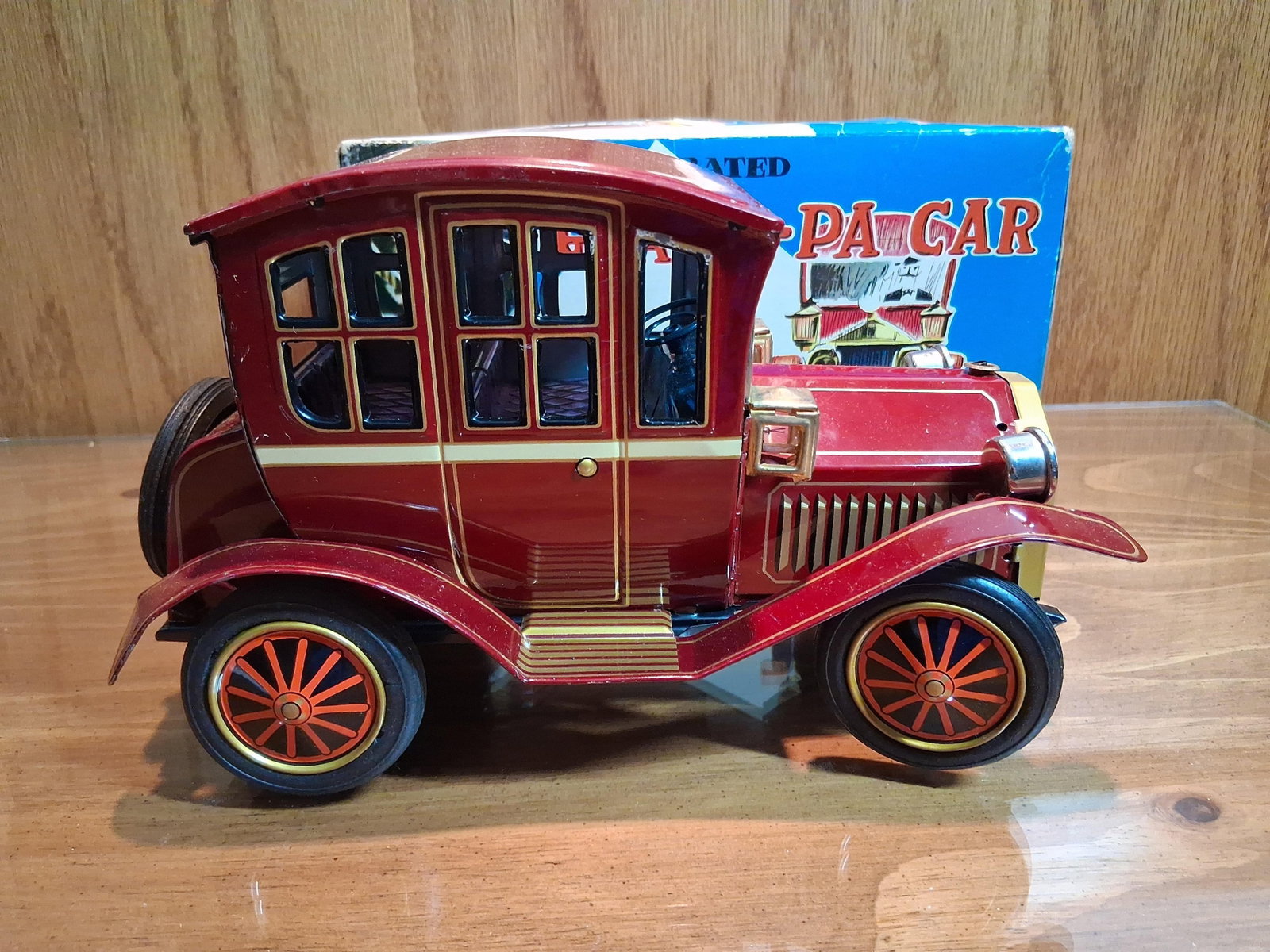 Vtg Japanese Battery Tin Grand-Pa Car w/ Box: Attributed to the Japanese manufacturer Yonezawa, this battery-operated toy is identified as the Grand-Pa Car. Styled after a brass-era veteran automobile, the toy is constructed with a lithographed t