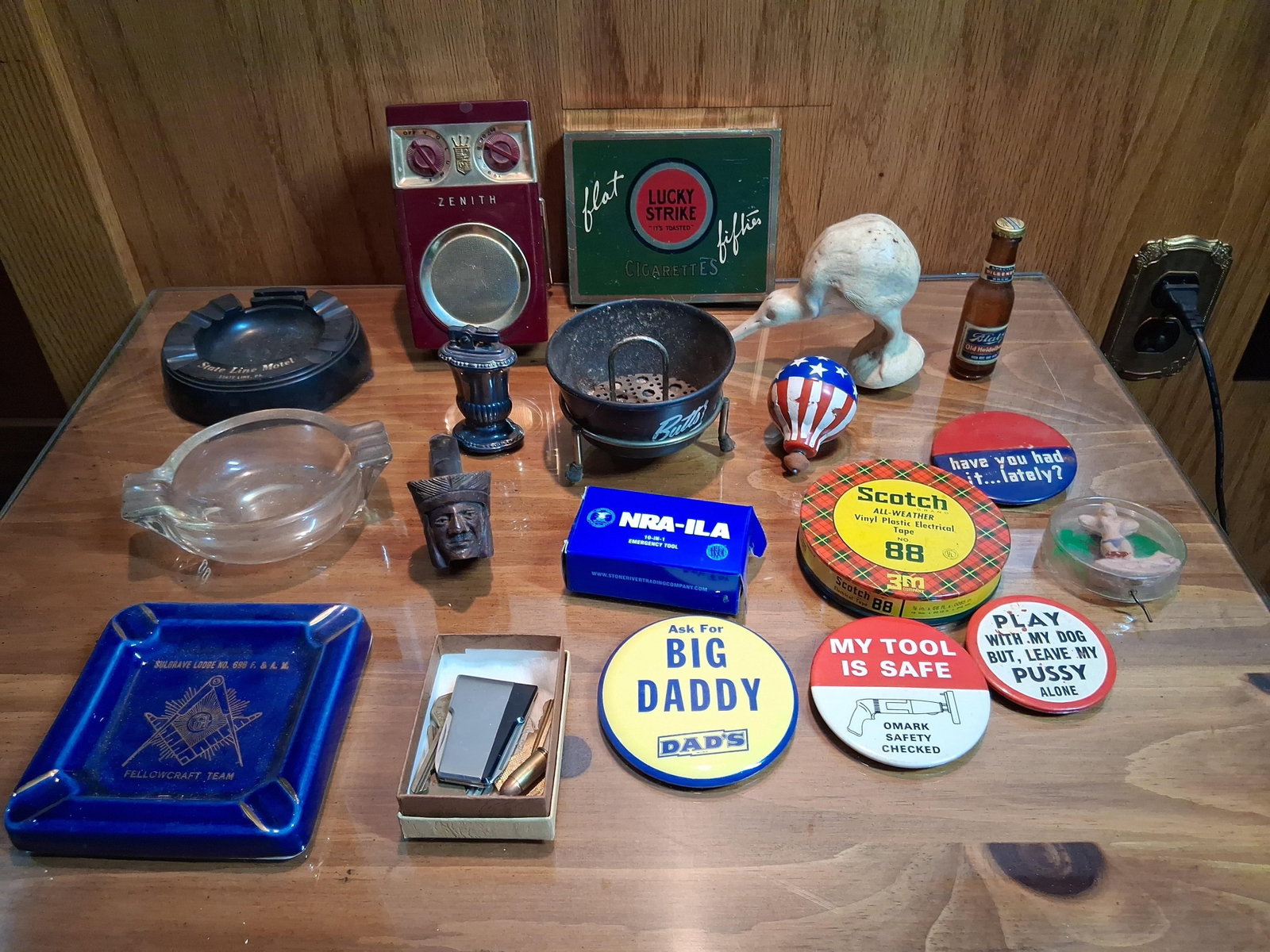Vtg Advertising, Tobacciana & Novelty Collectibles: This lot features a varied group of mid-20th-century promotional and novelty items. Included is a Zenith transistor radio housed in a burgundy plastic cabinet with gold-toned trim, a crown crest, and