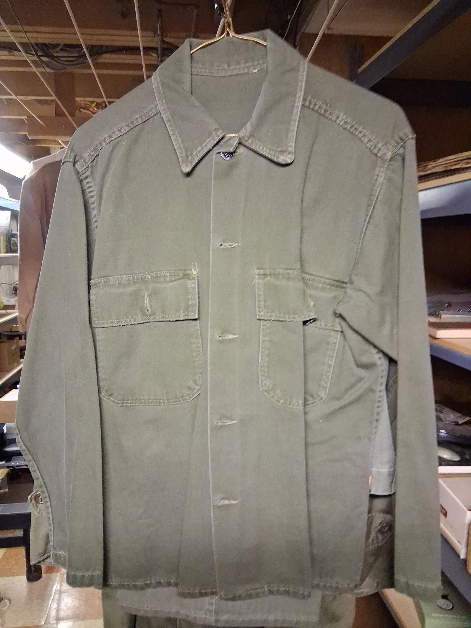US Military Mid-20th C. Uniforms, HBT & Overcoat: This group of United States military apparel includes an olive drab herringbone twill (HBT) utility set and a double-breasted overcoat. The utility set consists of an M1943 pattern shirt and matching