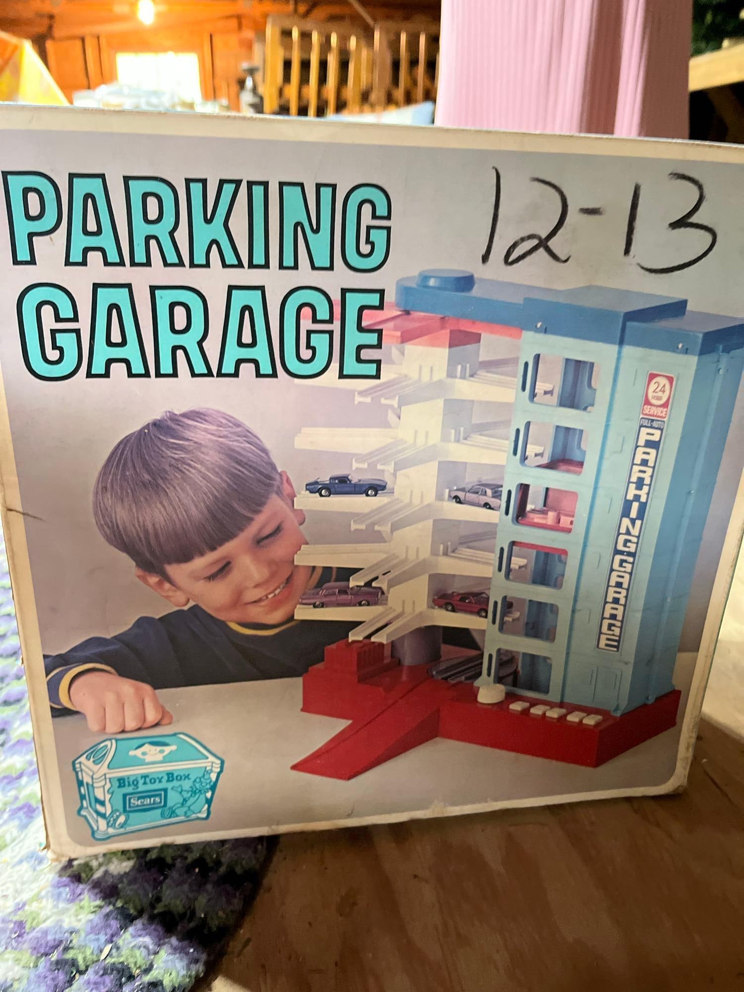 Sears Big Toy Box Vtg Parking Garage w/ Orig Box: A vintage Sears battery-operated parking garage toy, marketed under the Big Toy Box brand. The item is constructed predominantly from plastic and includes its original illustrated cardboard packaging.