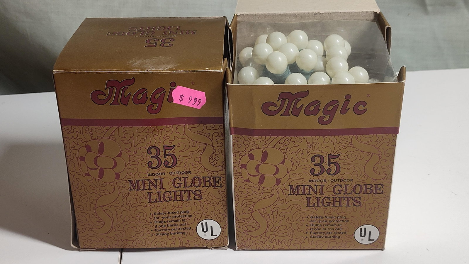 Magic 35 Globe Indoor/Outdoor String Lights: A collection of vintage-style string lights produced by the brand Magic. This grouping includes approximately five individual boxes and one loose bag of lights housed within a larger Cobra Premium