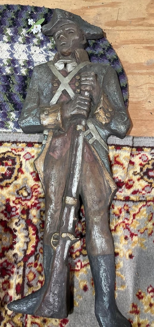 American Revolutionary Soldier Cast Metal Plaque: This is a mid-twentieth century decorative wall plaque in low relief depicting a soldier from the American Revolutionary War era. The figure is represented in full-length attire, including a tricorn