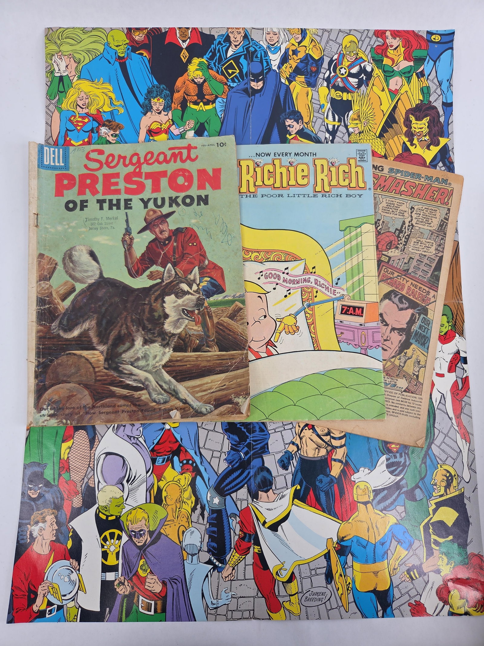 A Collection of Comic Books and Promotional DC Universe Posters (1 of 8)