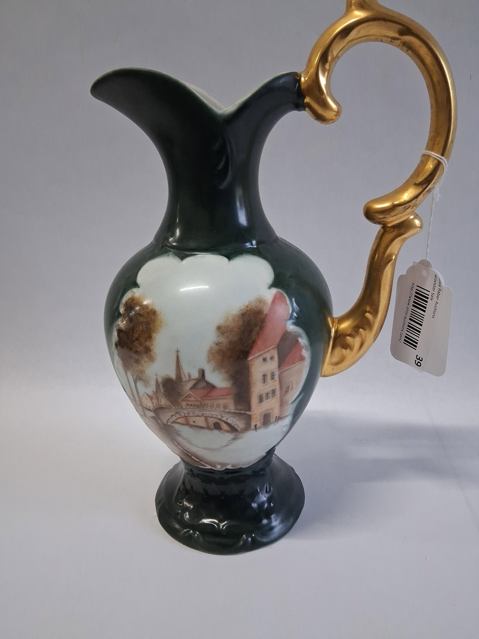 Gerold Porzellan Hand-Painted Porc. Pedestal Ewer: 13 in tall This pedestal-based decorative ewer was manufactured by Gerold Porzellan in Bavaria, West Germany. The porcelain vessel features a bulbous body, a slender neck flaring into a shaped spout,