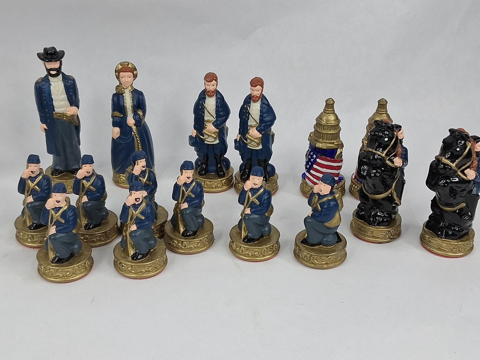 American Civil War Chess Set: A 32-piece themed chess set depicting historical figures and soldiers from the American Civil War. The set consists of hand-painted molded resin figurines divided into two factions: the Union (North) 