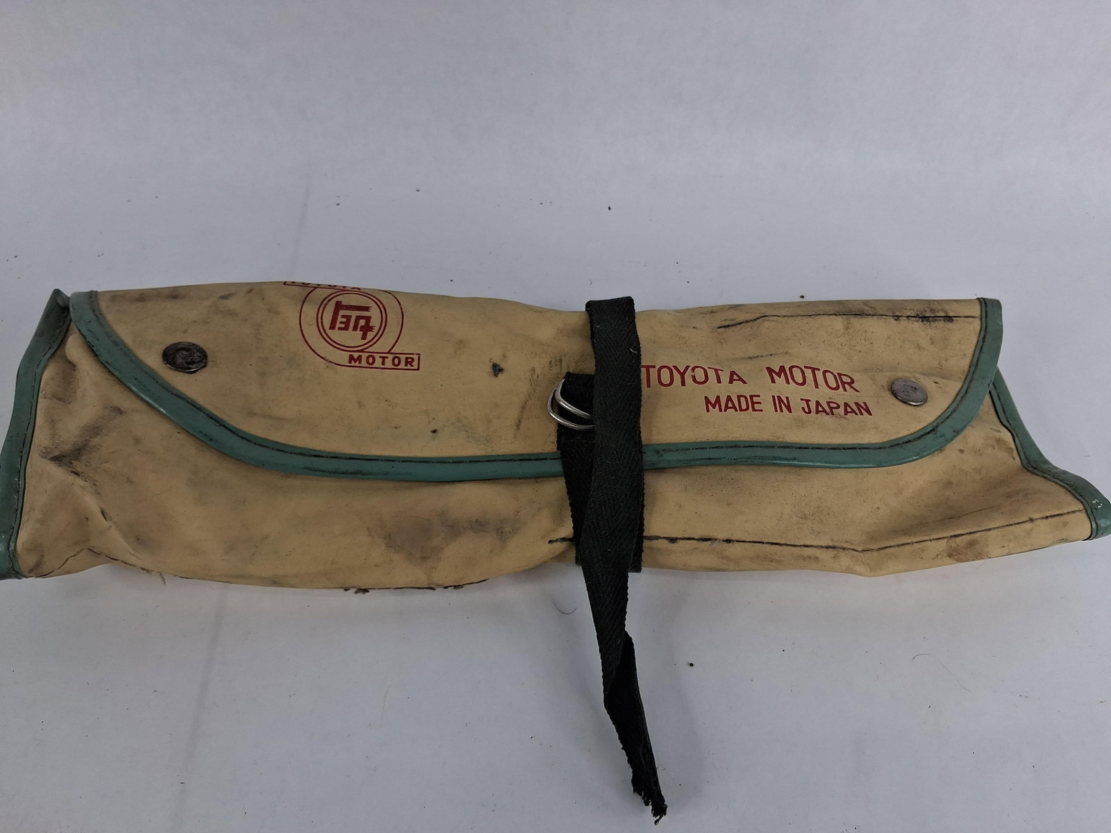 Toyota Motor Tool Kit and Vinyl Roll Bag: This is a factory tool kit and storage roll produced by Toyota Motor in Japan. This specific set was standard equipment for various Toyota vehicles from the late 1960s through the early 1980s,