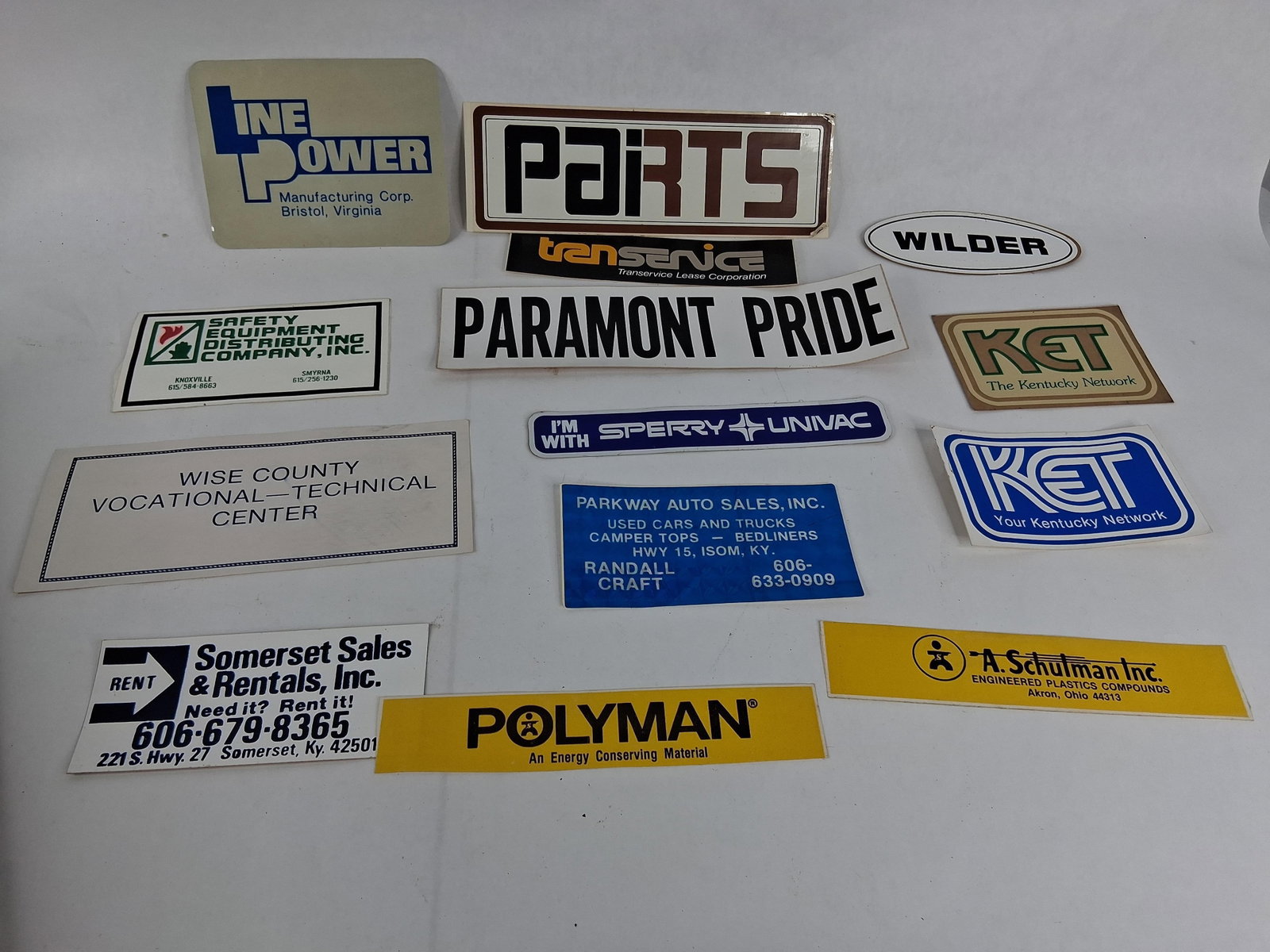 14 Appalachian Industrial & Commercial Decals: An assortment of 14 commercial and institutional decals and bumper stickers, primarily representing businesses and organizations from the Appalachian and Tri-State regions of Virginia, Tennessee,