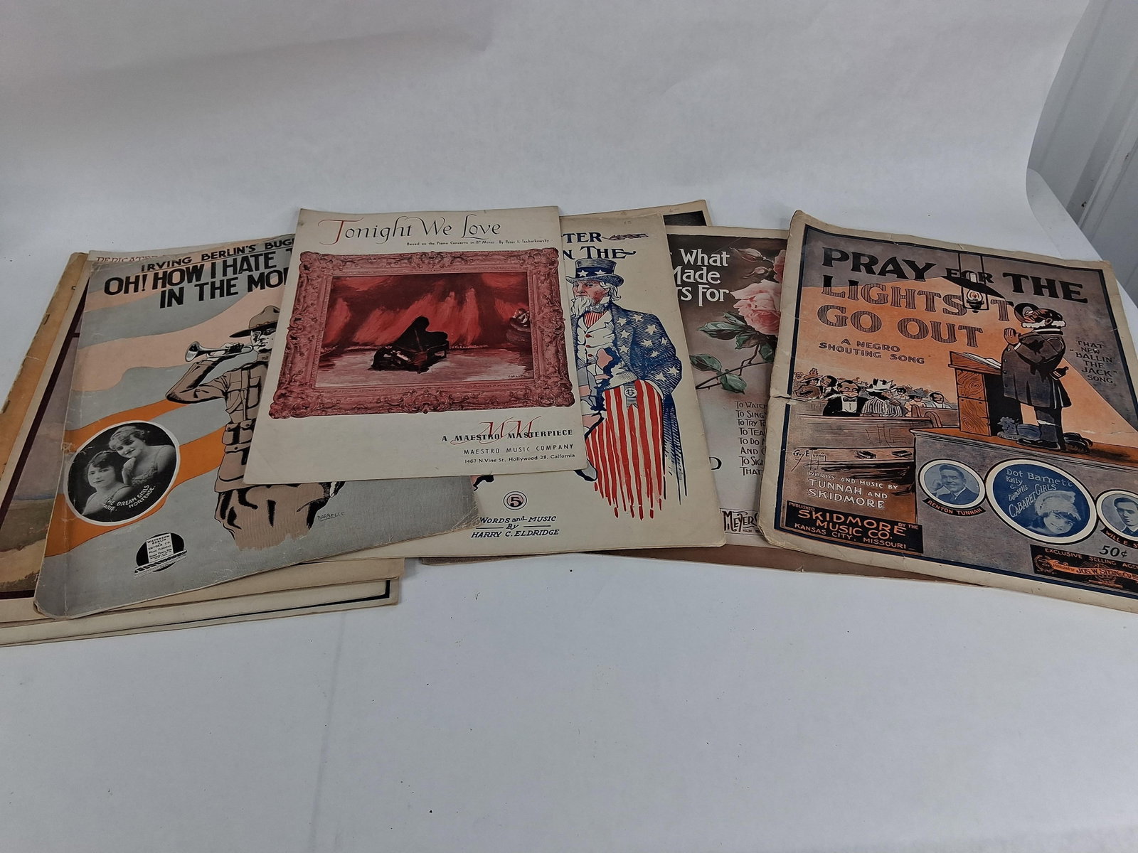 Berlin, Cohan, Paull et al. Sheet Music, 1907-41: This collection of sheet music contains multiple paper booklets from the early 20th century, primarily featuring popular songs, marches, and waltzes. Notable inclusions are Irving Berlin's Oh! How I H