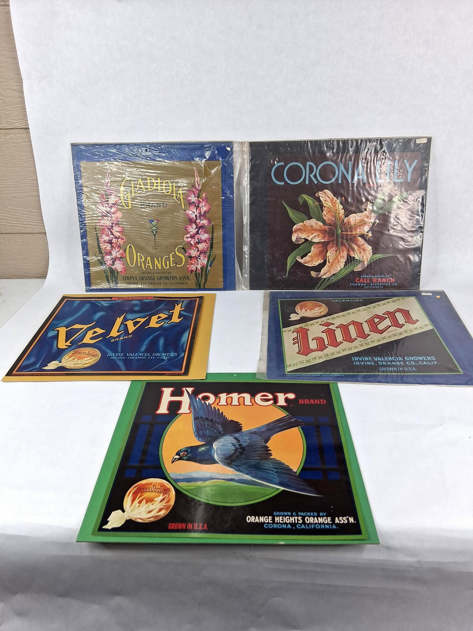 Homer & Sunkist California Citrus Crate Labels: This collection consists of five color lithograph citrus crate labels produced for Southern California growers, dating to approximately 1929 and the early 20th century. These labels were originally