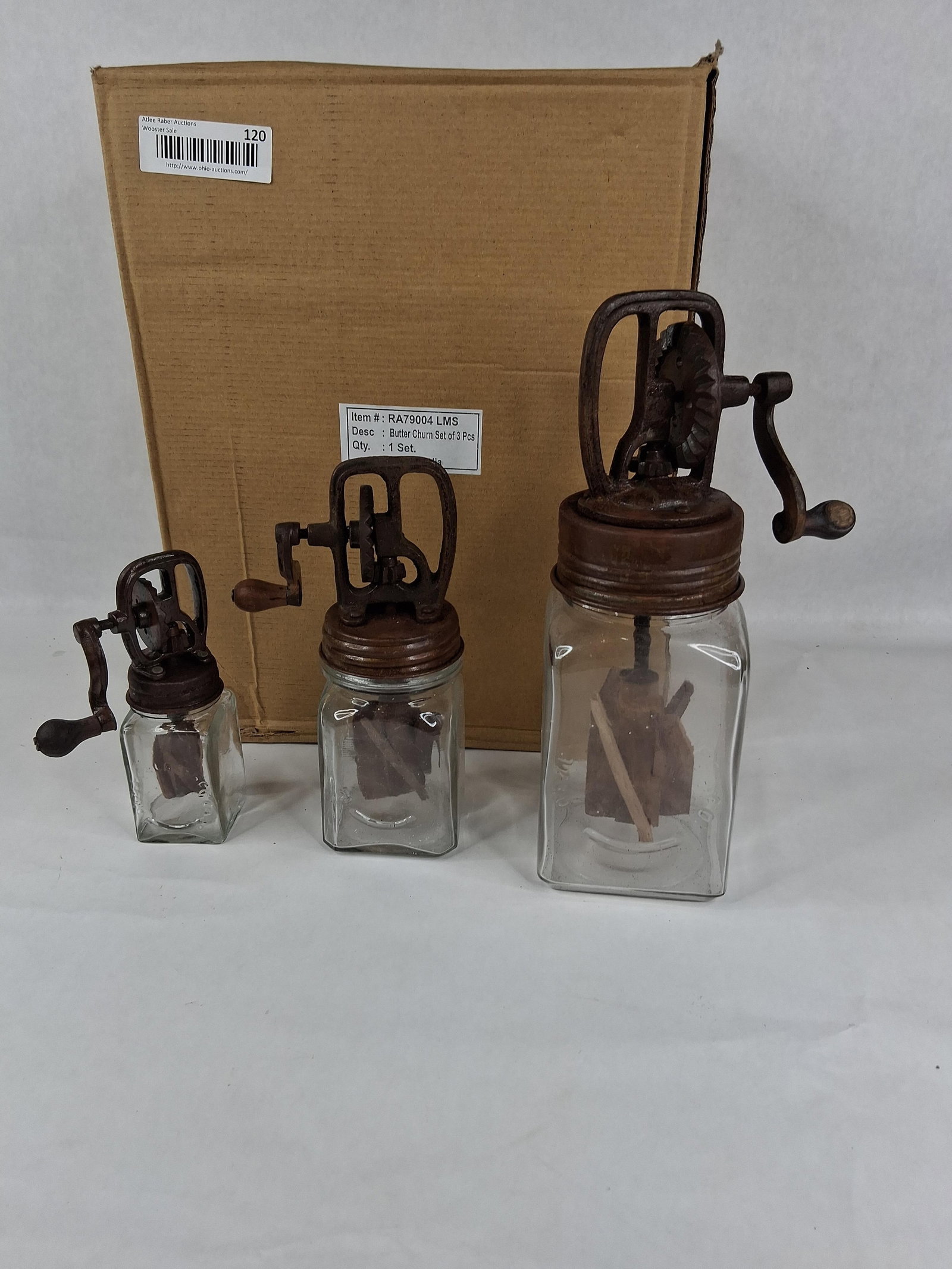 Set 3 Primitive Style Butter Churns: A set of three graduated hand-crank butter churns, modeled after Dazey designs. The collection includes three different sizes: small, medium, and large. Each churn is constructed with a square-form cl