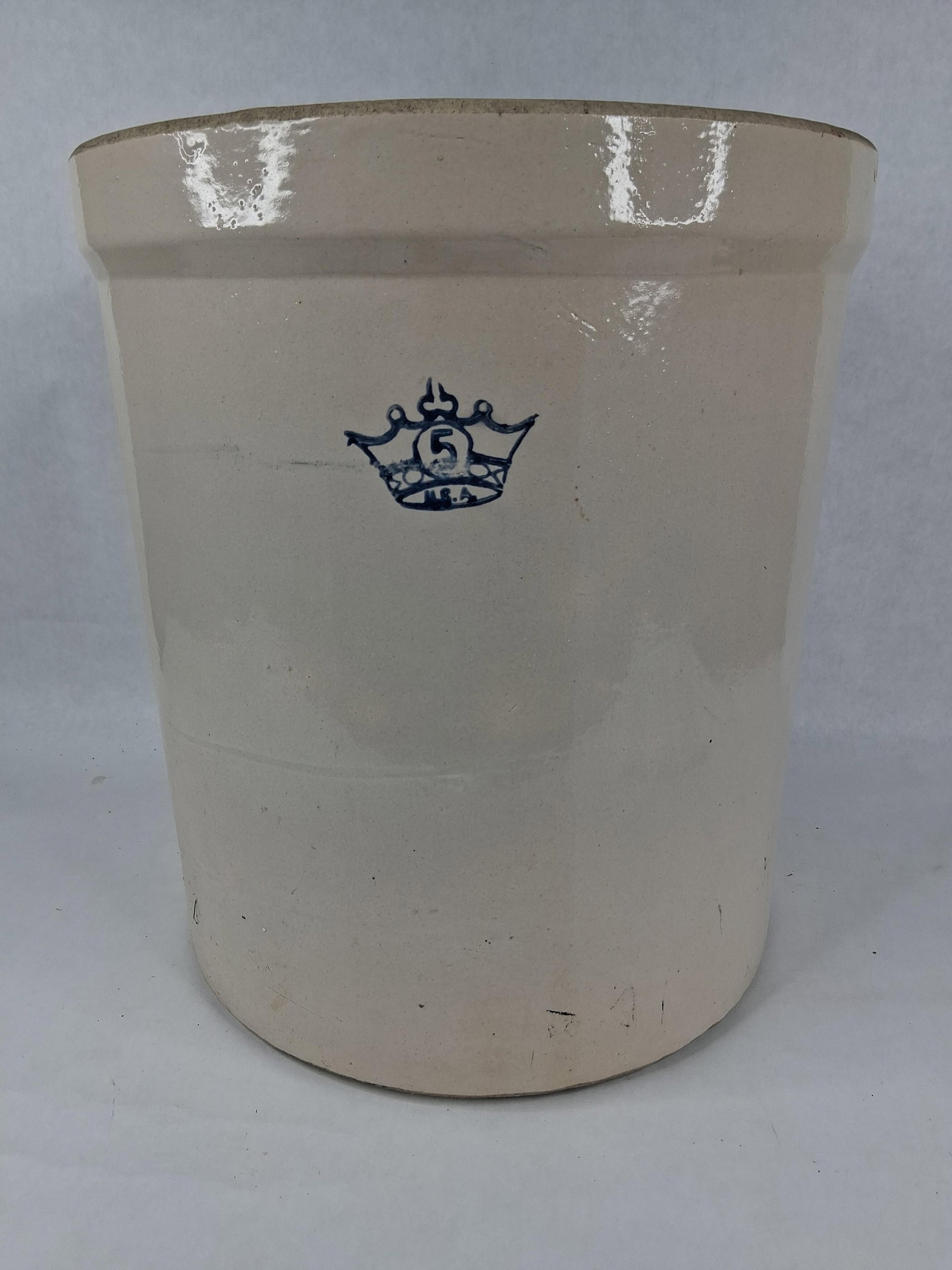 Robinson Ransbottom Blue Crown Stoneware Crock: 12.5 dia 14 in tall This large, cylindrical stoneware crock was produced by the Robinson Ransbottom Pottery Company of Roseville, Ohio. The vessel features straight sides and a thick, rounded rim.