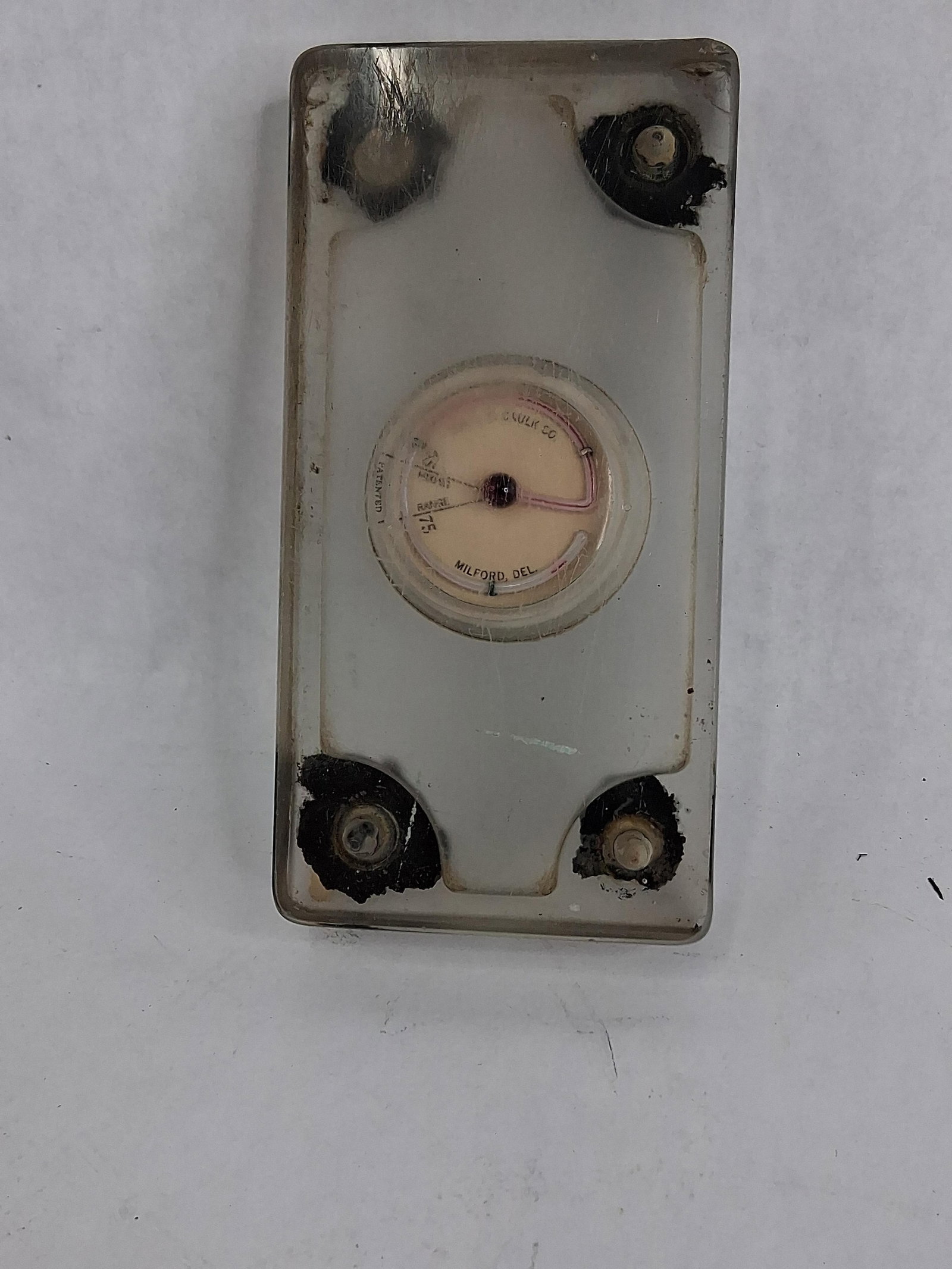 L. D. Caulk Co. Frosted Glass Mixing Slab w/ Gauge: 3x6x1A dental laboratory instrument manufactured by the L. D. Caulk Company of Milford, Delaware. The device consists of a heavy, rectangular block of translucent frosted glass designed to serve as a