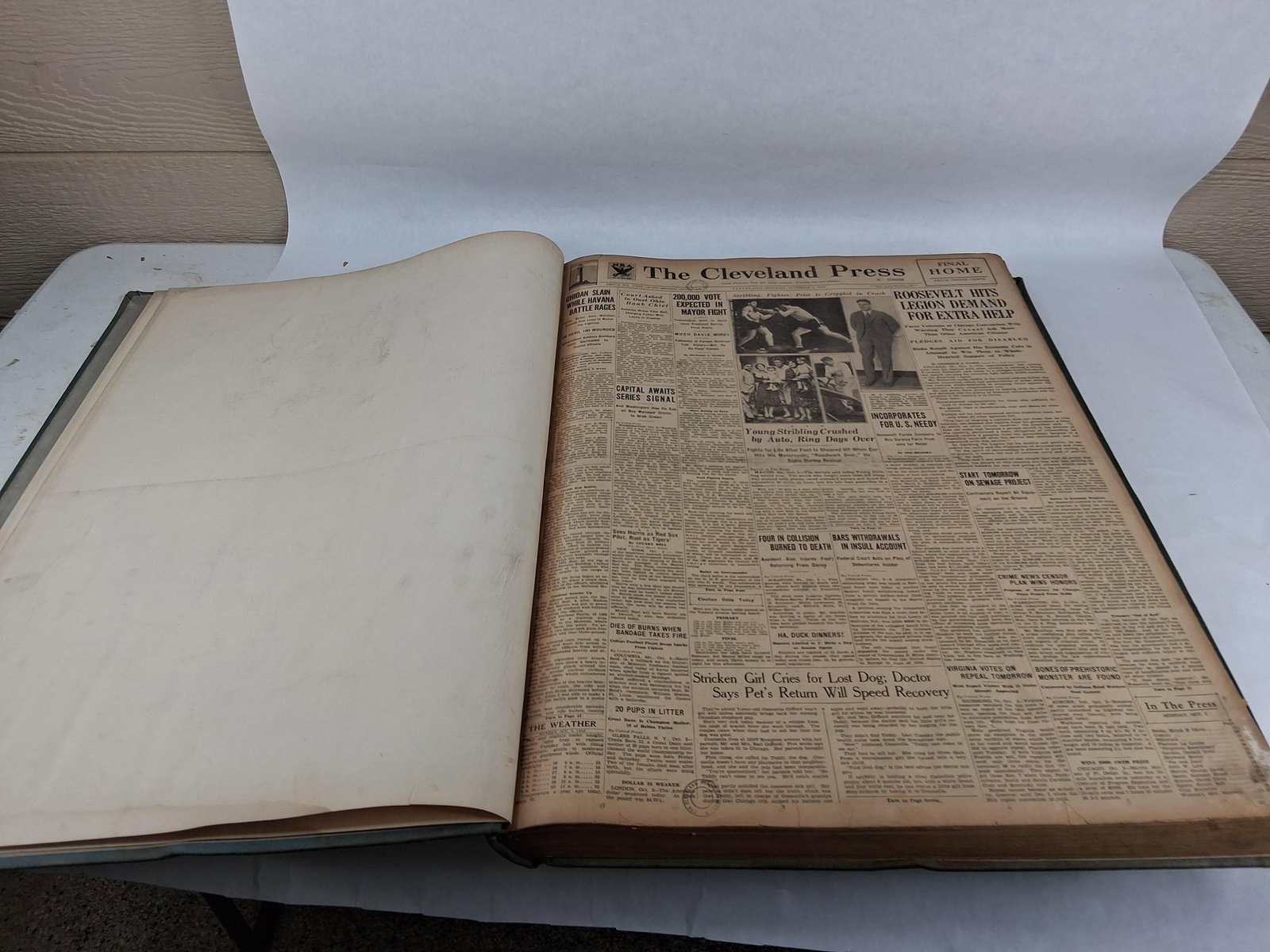 Scripps-Howard Cleveland Press Bound Vol Oct 1933: 17x24 This is a large, folio-sized bound volume of The Cleveland Press, comprising a complete run of daily issues for the entire month of October 1933. The item is bound in heavy, blue-gray buckram cl