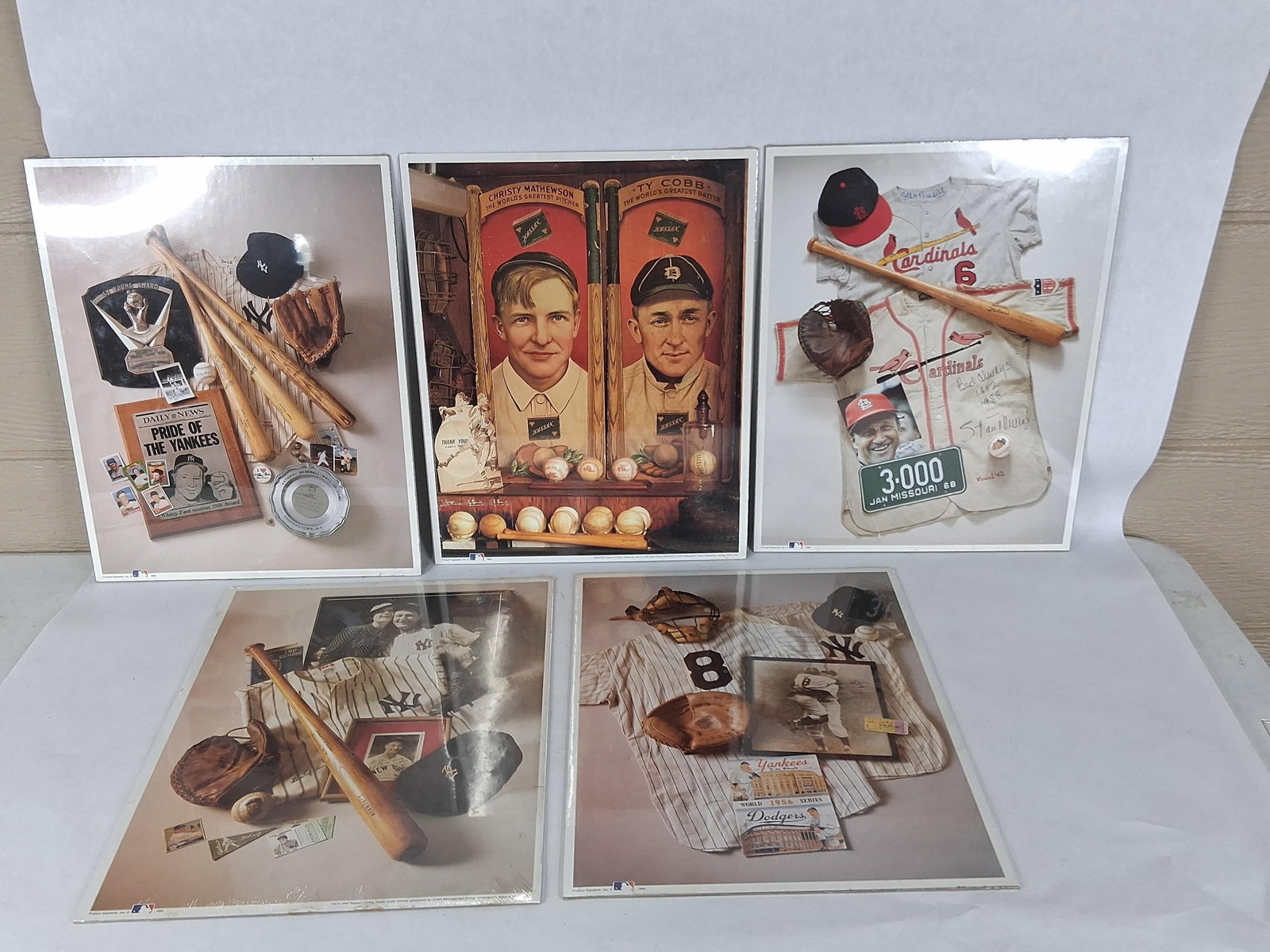 Product Exposure Inc. MLB Memorabilia Prints 1993: This is a set of five Major League Baseball memorabilia photographic prints produced in 1993 by Product Exposure, Inc. Each print features a high-quality still-life collage of historical equipment,