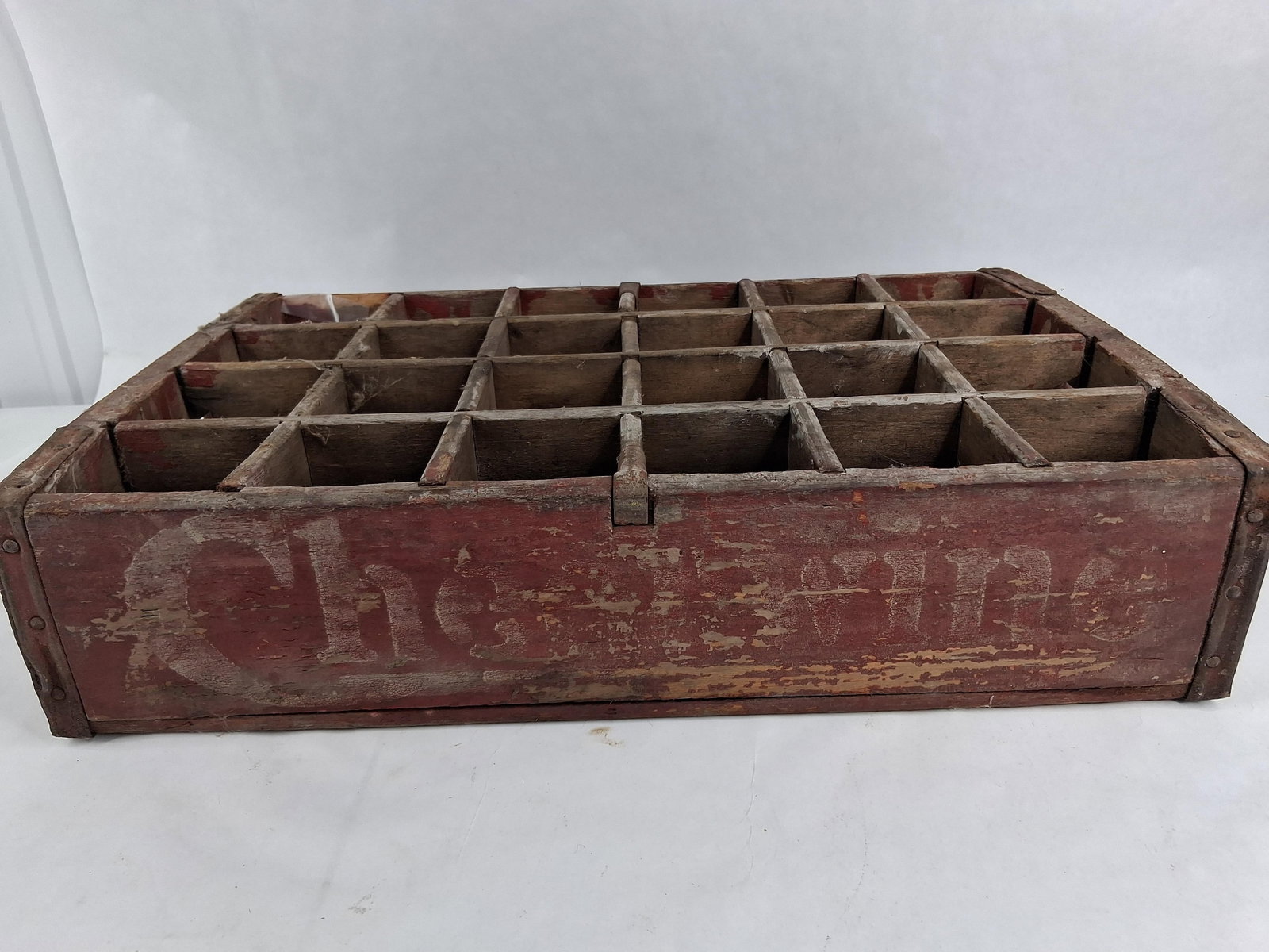 Cheerwine Wooden 24-Bottle Soda Crate: A rectangular wooden beverage storage and transport crate featuring twenty-four individual interior compartments arranged in a four-by-six grid designed for standard soda bottles. The crate is