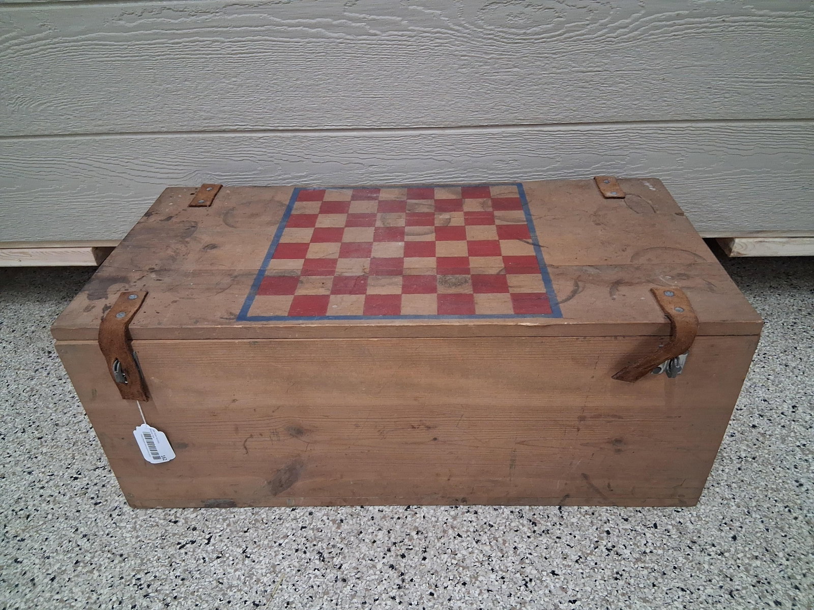 Primitive Wooden Chest w/ Painted Game Board Lid: 15x32x13 This primitive wooden storage chest is constructed of pine planks joined with butt joints. The flat lid features a hand-painted 8 by 8 square game board pattern executed in red and natural