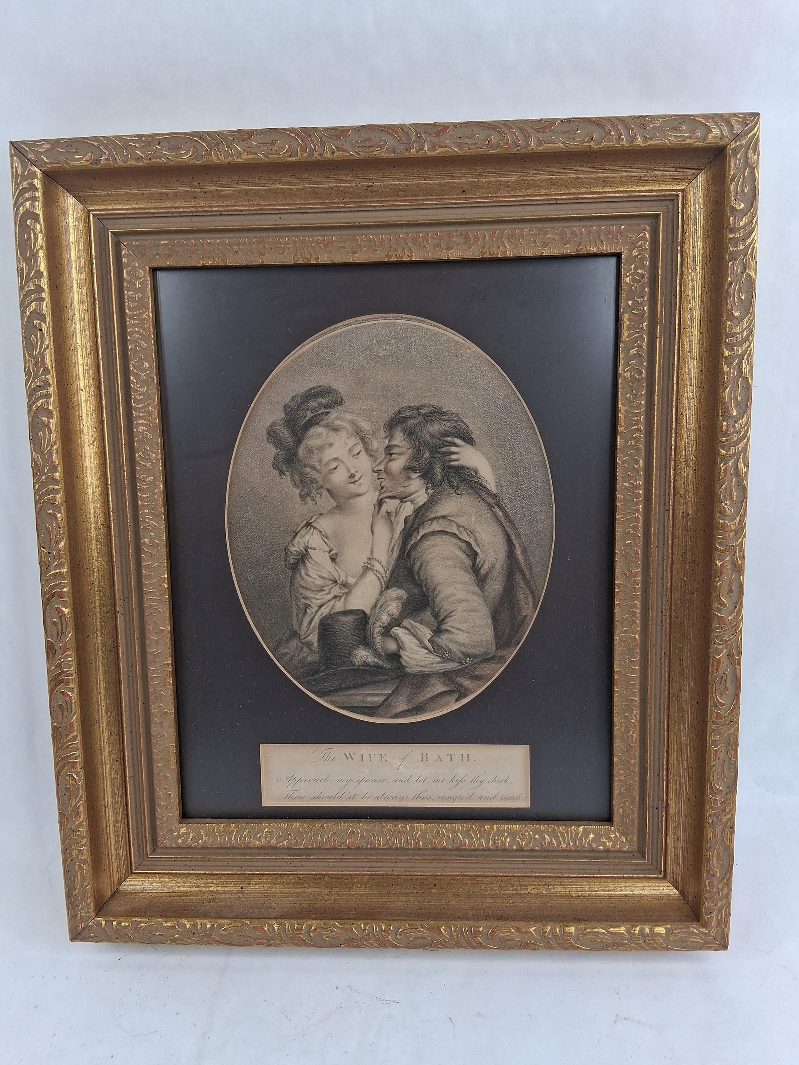 The Wife of Bath Stipple Engraving, Gilt Frame: 12x14 This stipple engraving, titled The WIFE of BATH, is presented in an oval format and depicts a romantic scene between a man and a woman in period dress. The image is executed using a fine