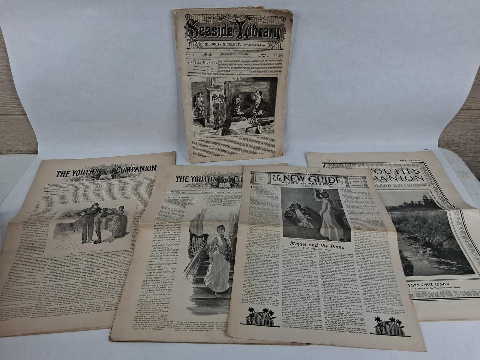American Story-Papers & Periodicals, 1878-1932: This lot consists of a collection of American newspapers and story-paper periodicals. The primary item is an issue of the Seaside Library, Volume X, Number 200, dated January 7, 1878, published by Geo