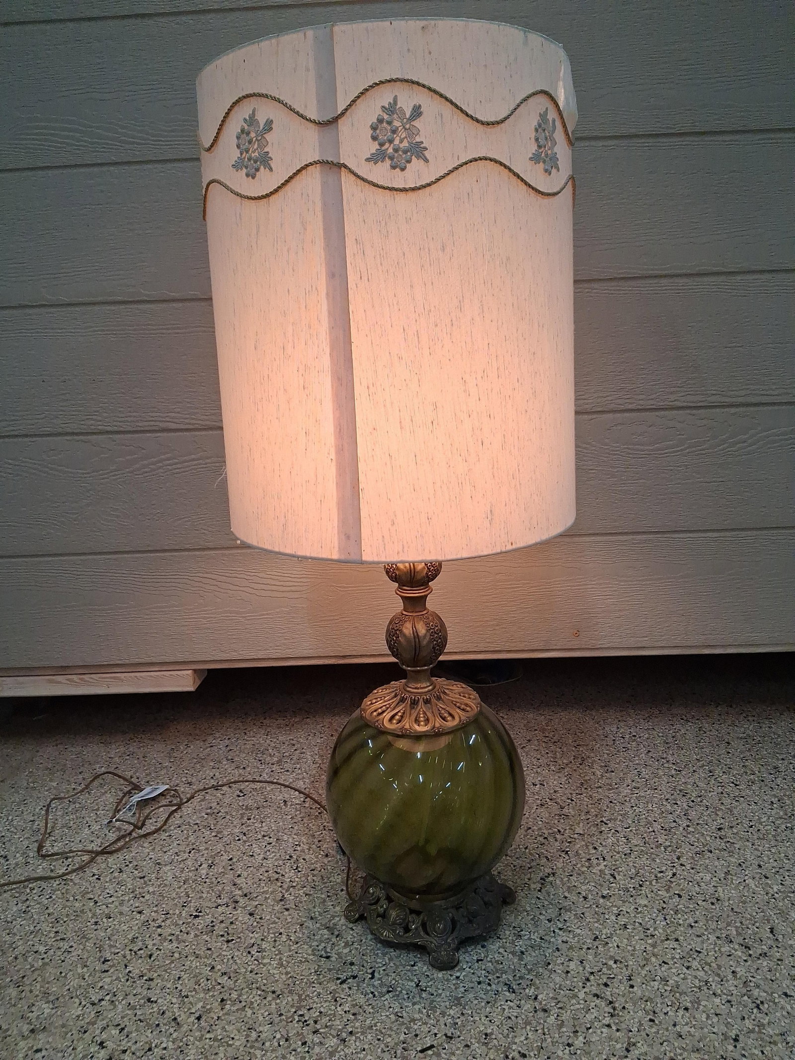 Hollywood Regency Olive Green Glass Table Lamp: 39in tall A mid-century table lamp designed in the Hollywood Regency style, dating to approximately the 1960s or 1970s. The piece features a central bulbous body of olive green glass with molded