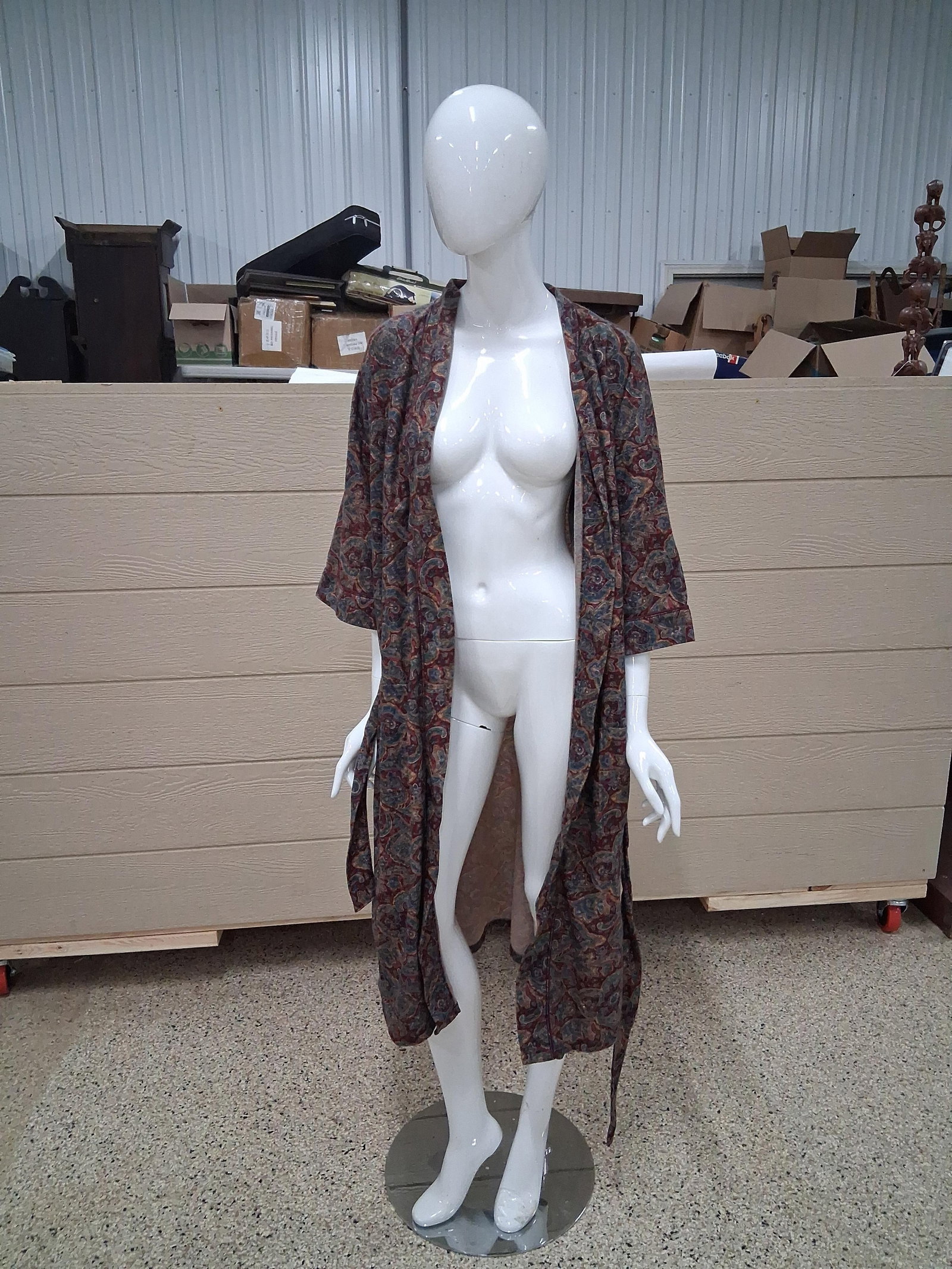 Paisley Print Full Length Robe and Glossy: 71 in tall This lot consists of a full-length robe and a professional display mannequin. The robe is crafted from a lightweight woven fabric featuring an intricate paisley print in a color palette of