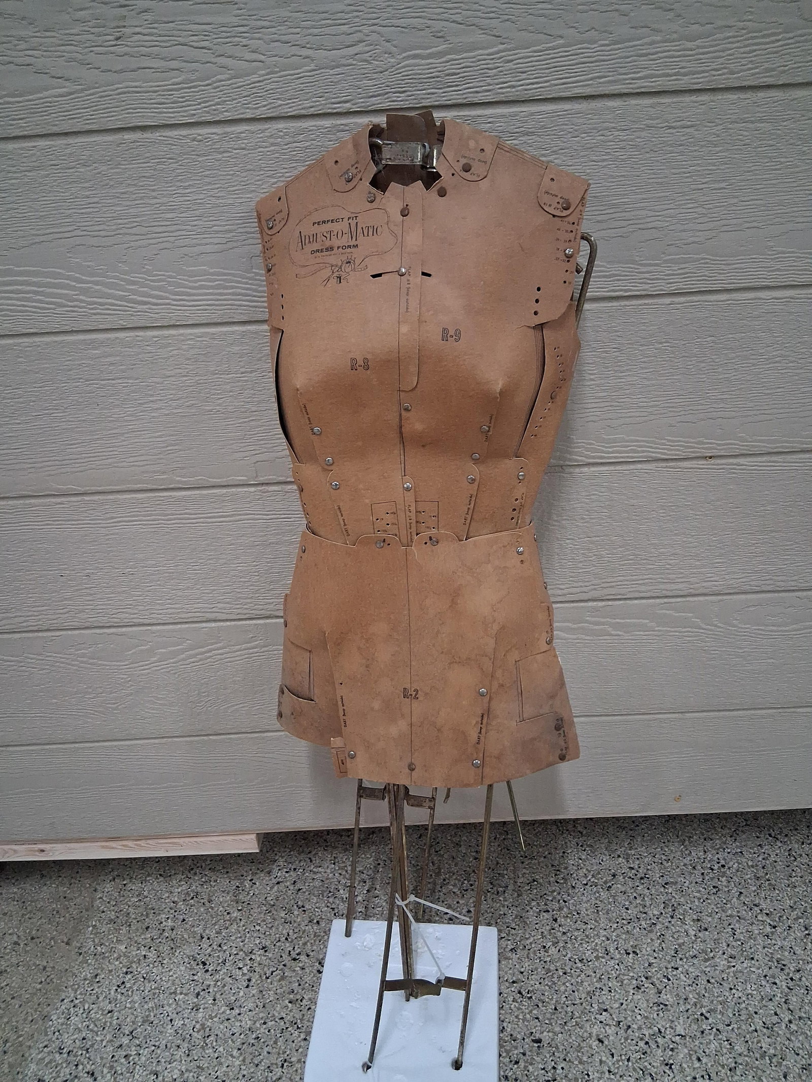 Perfect Fit Adjust-O-Matic Dress Form: 48 in tall This adjustable dress form is identified as a Perfect Fit Adjust-O-Matic model, featuring a design patented in 1960 under U.S. Patent No. 2,922,555. The form is constructed from multiple