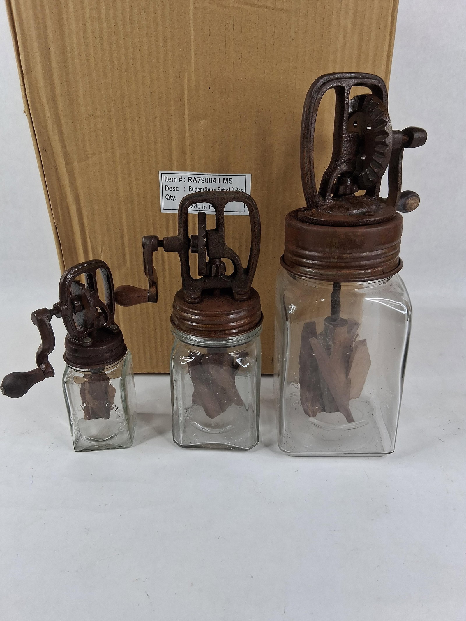 Set 3 Dazey-Style Glass Butter Churns: A graduated set of three contemporary reproduction glass butter churns designed in the style of antique Dazey manual churns. The set consists of three sizes, each featuring a square glass jar and a