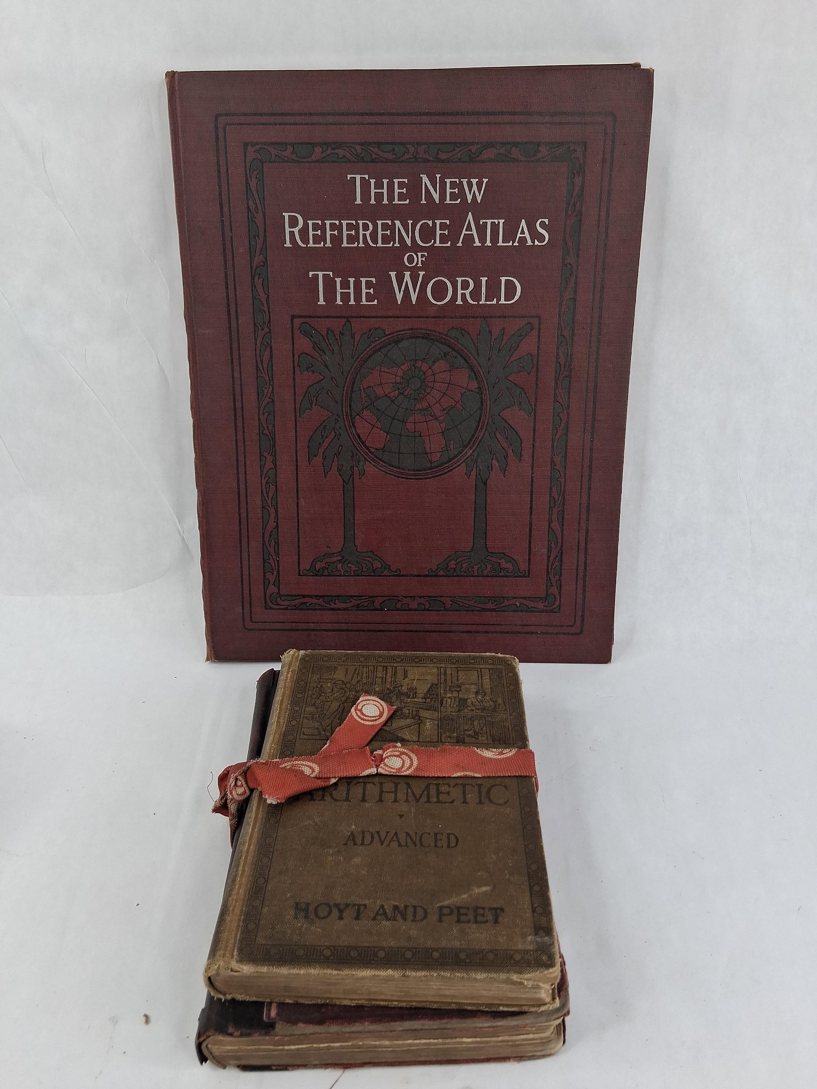 C.S. Hammond New Reference Atlas & 2 Vols, 1912: This lot comprises three antique educational volumes. The primary work is The New Reference Atlas of the World, published by C. S. Hammond & Company in 1912. This folio-sized volume is bound in