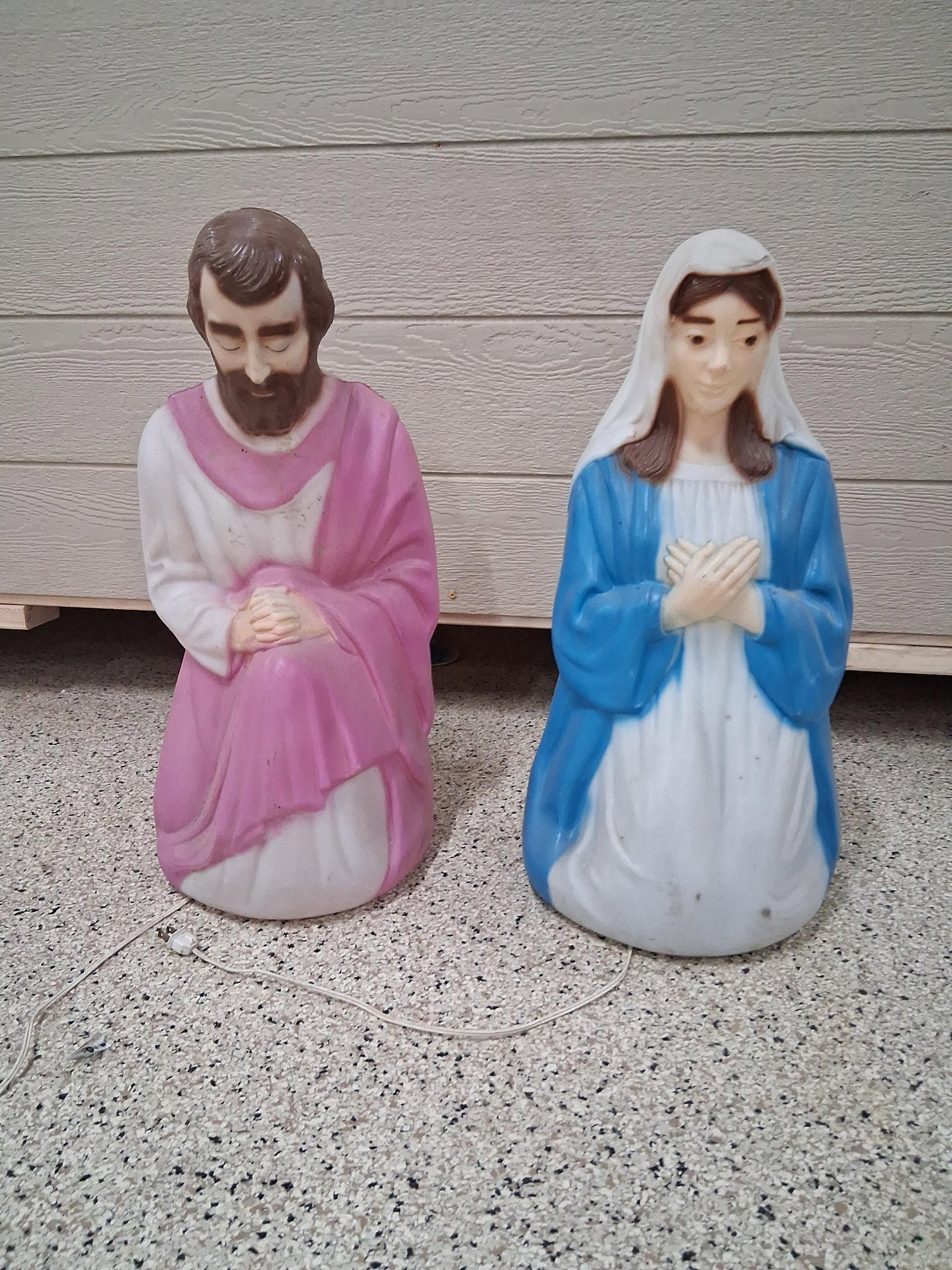 Pair Empire Lighted Mary & Joseph Blow Molds: This pair of Christmas nativity blow mold figures is manufactured by the Empire Plastic Corp. The set consists of two kneeling figures representing Mary and Joseph. Each figure is constructed from