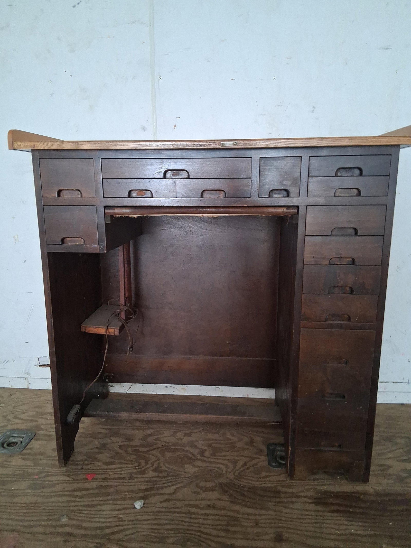J.H. Rosberg Mfg. Co. Watchmaker's Workbench: 40x20x38 Manufactured by the J.H. Rosberg Mfg. Co. of Chicago, this specialized watchmaker's or jeweler's workbench is constructed from hardwood with a dark-stained finish. The piece features a