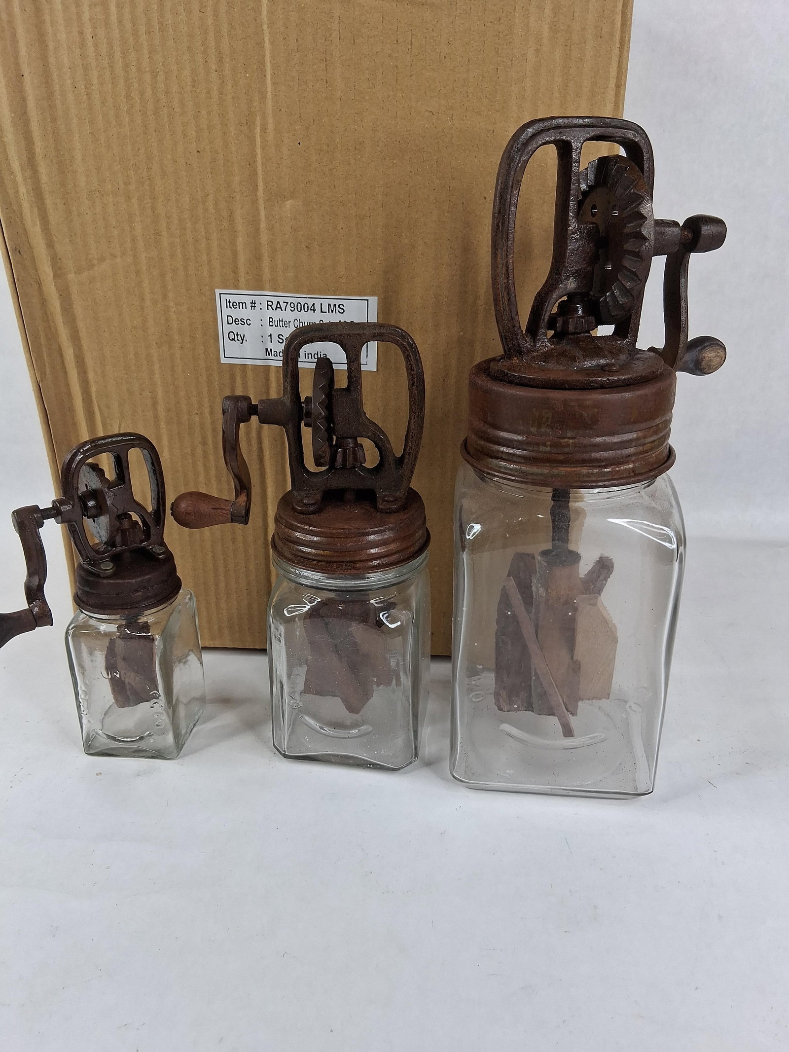 Set 3 Dazey Style Glass & Cast Metal Butter Churns: This set consists of three reproduction butter churns in graduated sizes, identified by the provided documentation as a set of three pieces. The design is modeled after antique Dazey brand churns.