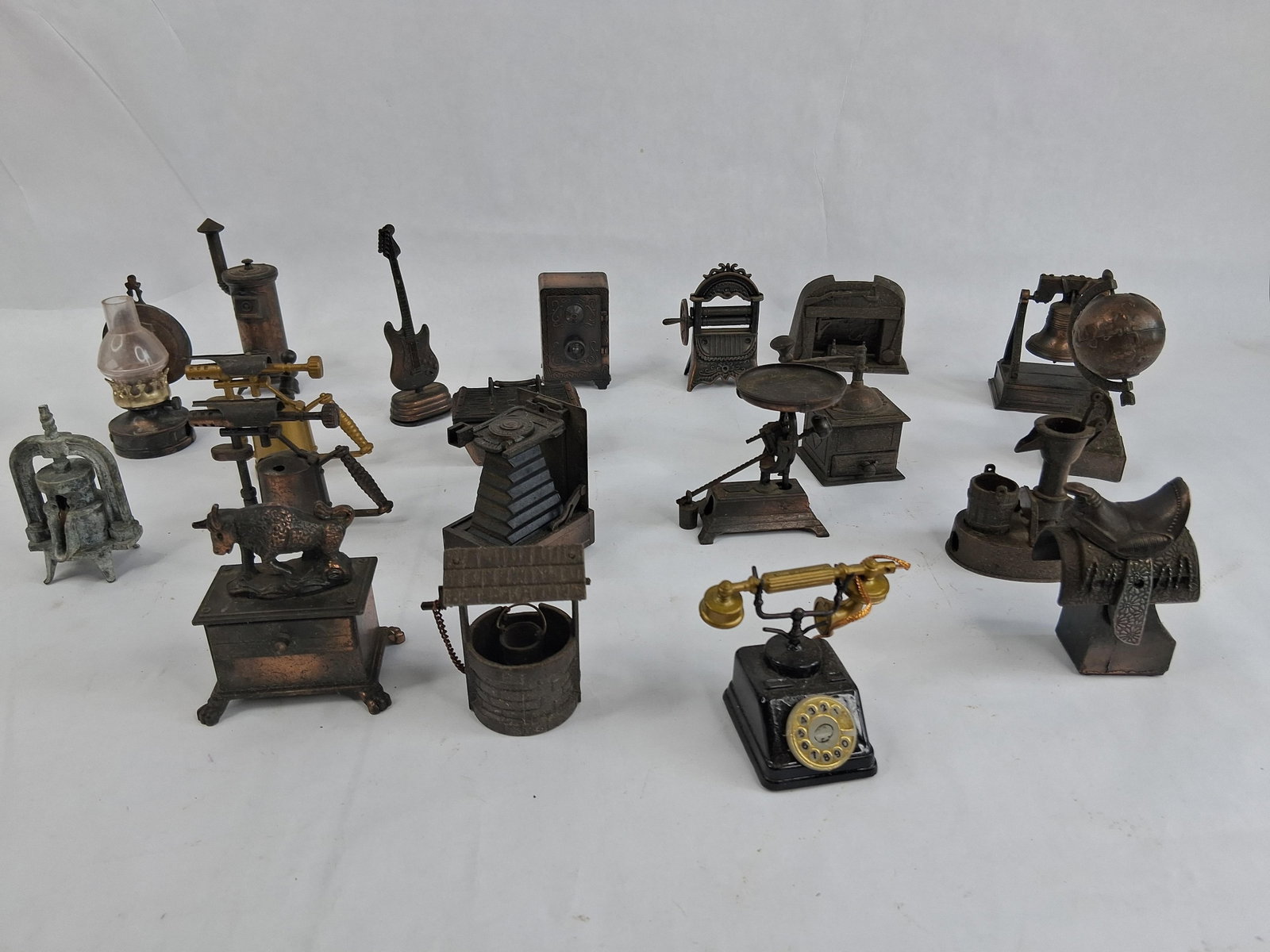 Novelty Miniature Pencil Sharpeners: An assortment of miniature pencil sharpeners in the style of manufacturers such as Play Me of Spain and Durham. These items are manufactured from die-cast metal, primarily featuring an antiqued