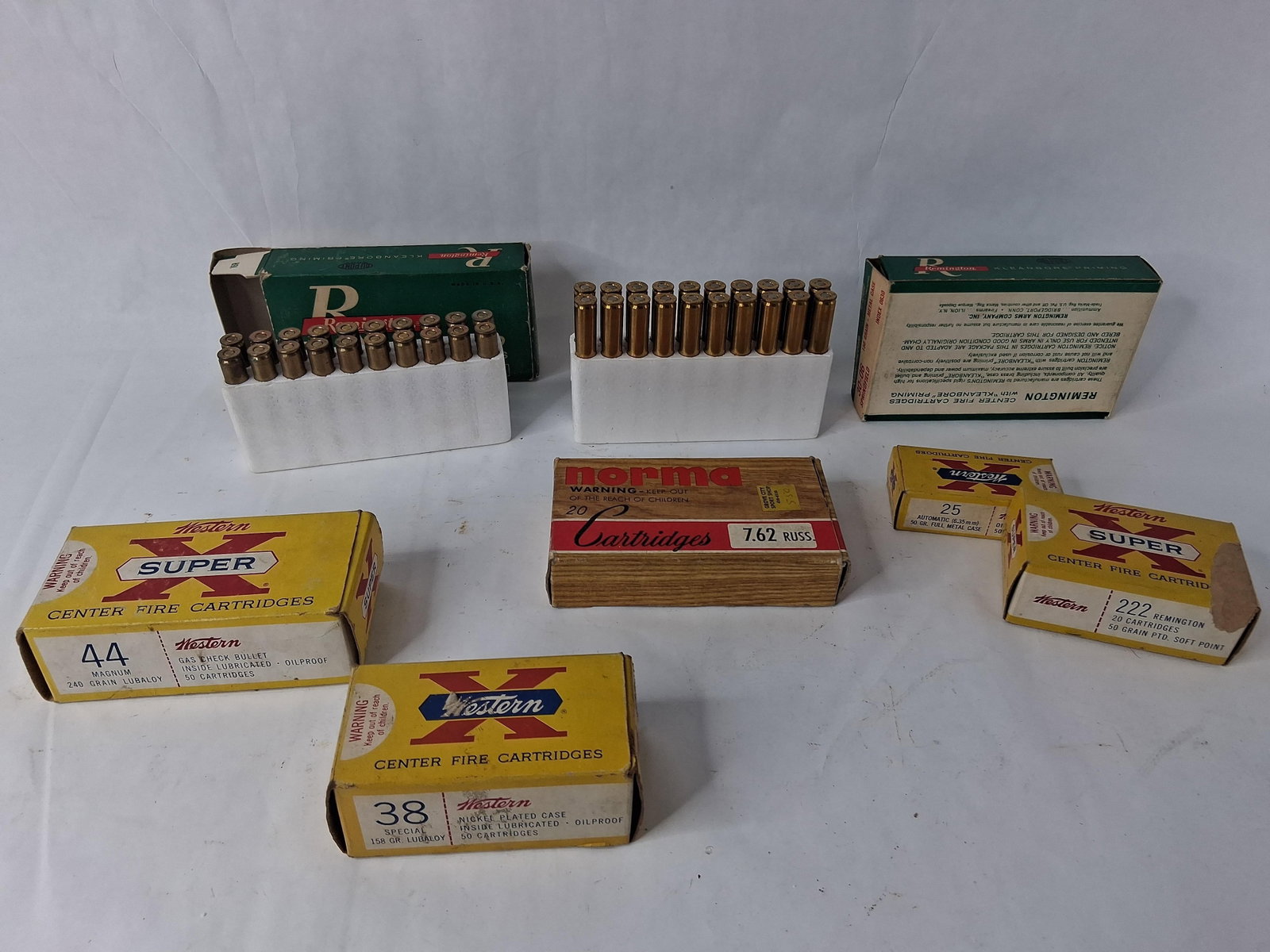 7 Boxes Misc Ammo & Vintage Boxes: Includes 44 mag, 38 special, 25 auto, 222 Remington, 30 Au 6, and more. Some are full, some are partial.