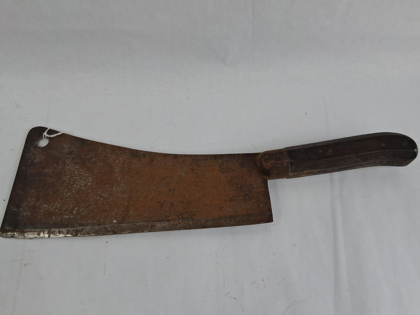 Carbon Steel Butcher Cleaver w/ Textured Grip: 16 in overall lengthThis butcher's cleaver is constructed with a heavy carbon steel blade and a full tang. The blade features a rectangular profile with a slightly curved spine and a circular hanging