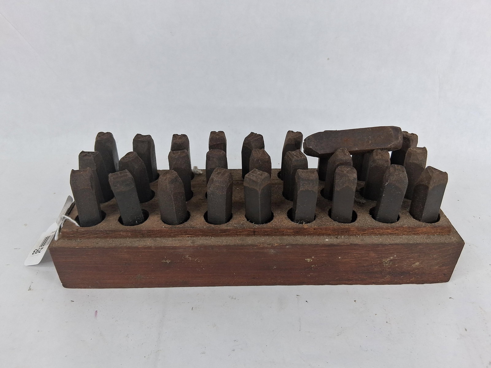 Set Steel Letter Punch Stamps in Wood Block: This is a set of 26 steel hand-punch letter stamps housed in a wooden storage block. Each punch is constructed from forged steel and features a relief-cut, reversed character on the tip intended for