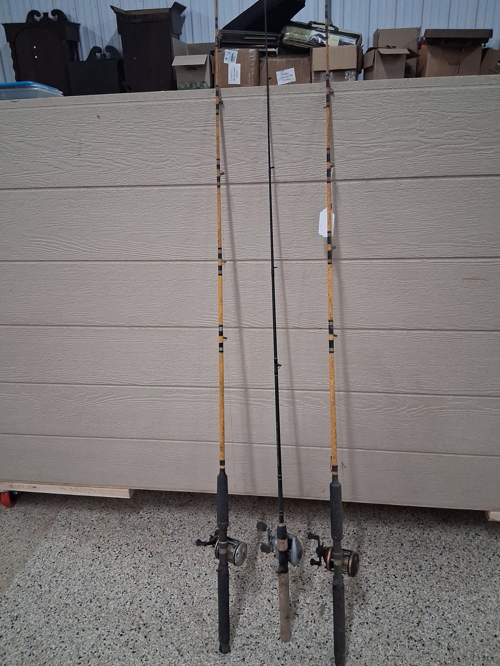 Abu Garcia & Pflueger Baitcasting Rod & Reel Set: This lot features three complete baitcasting fishing rod and reel assemblies. Two of the rods are matching yellow-blank Wright and McGill Co. Eagle Claw Starfire T.M. Granger Ocean Muskie rods, model