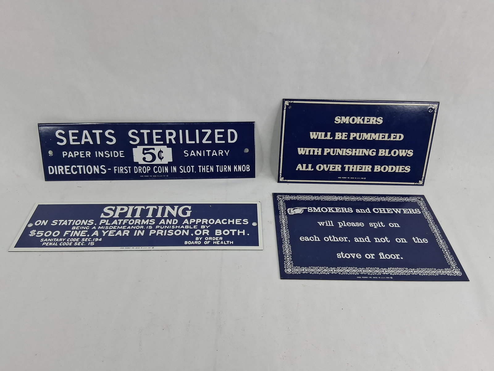 Set Ande Rooney Porc. Enamel Public Notice Signs: 8.5 and 12 in long This set of four reproduction signs was manufactured by Ande Rooney Inc. between 1986 and 1988. Each sign is constructed from heavy-gauge steel with a high-gloss porcelain enamel