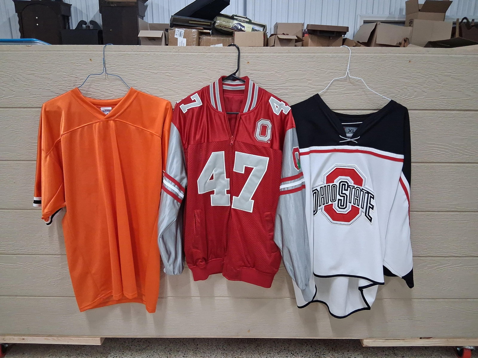 Set Ohio State Buckeyes & Don Shula Signed Apparel: This lot features three items of sports apparel, including a signed commemorative jersey and two pieces of Ohio State Buckeyes fan gear. The first item is a bright orange football jersey manufactured