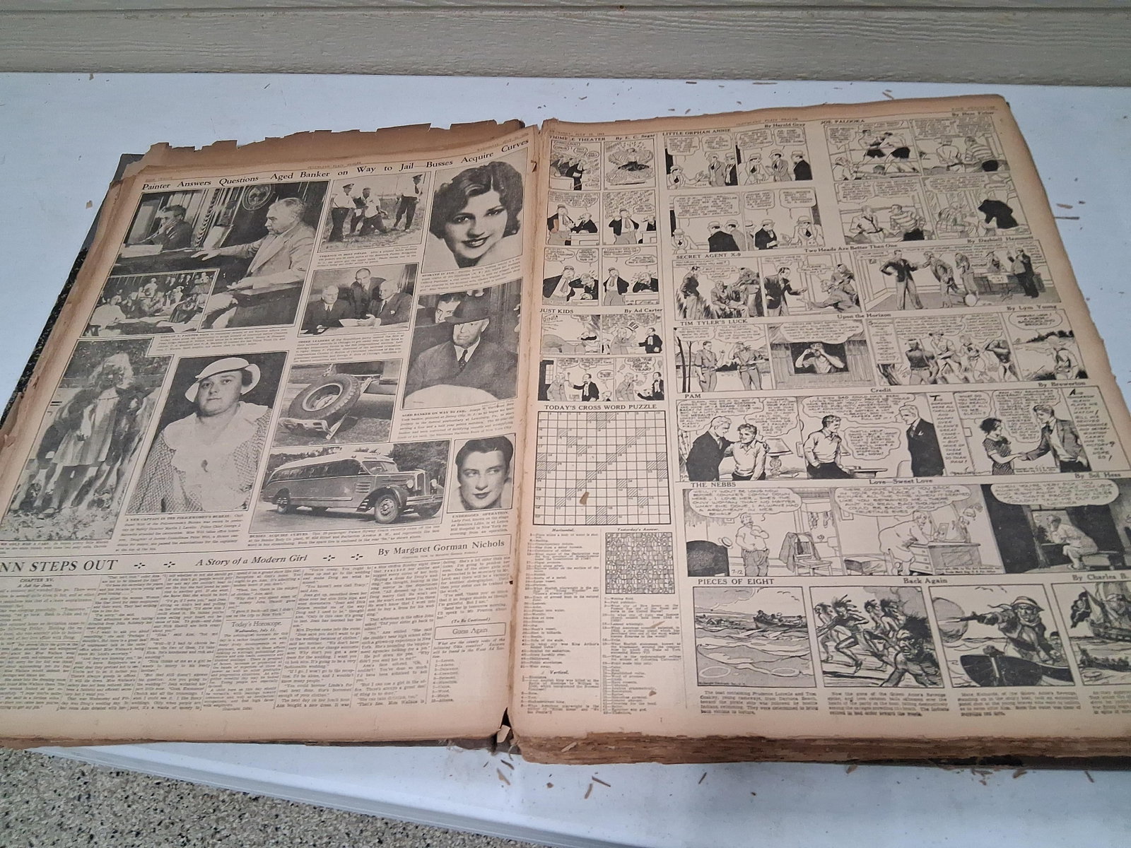 Cleveland Plain Dealer Comics & Wirephotos 1934-35: 18x24 This oversized folio volume contains a substantial collection of daily newspaper pages extracted from the Cleveland Plain Dealer, primarily spanning the years 1934 and 1935. The assembly focuses