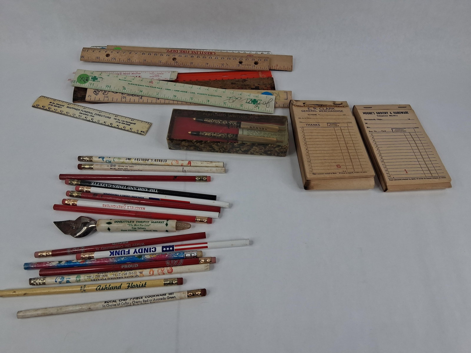 N. Central Ohio Advertising Ephemera & Accessories: This lot comprises an assortment of promotional items and office supplies, primarily from the North Central Ohio region. The collection includes a group of wooden advertising pencils featuring