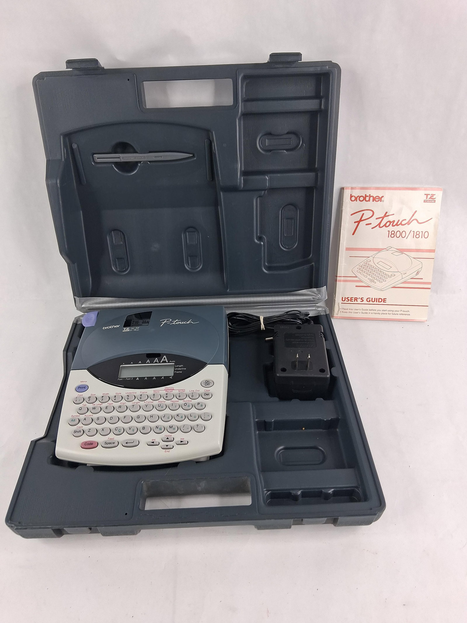 Brother PT-1800 Label Maker w/ Case & Accessories: Brother P-touch PT-1800 electronic labeling system set. The comprehensive kit includes the portable labeling unit featuring a QWERTY keyboard and an integrated liquid crystal display (LCD). The set