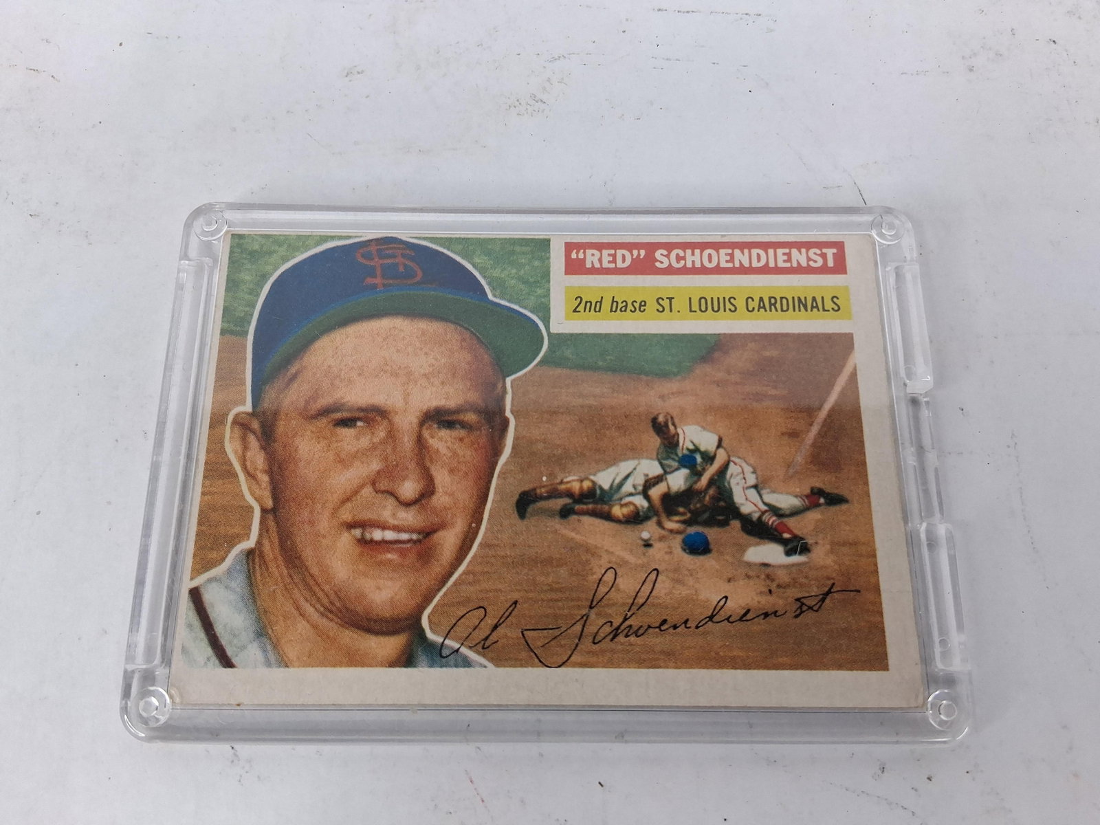 1956 Topps Red Schoendienst Baseball Card #165: This 1956 Topps baseball card features Hall of Fame second baseman Red Schoendienst of the St. Louis Cardinals, identified as card number 165. The card is designed with the horizontal orientation
